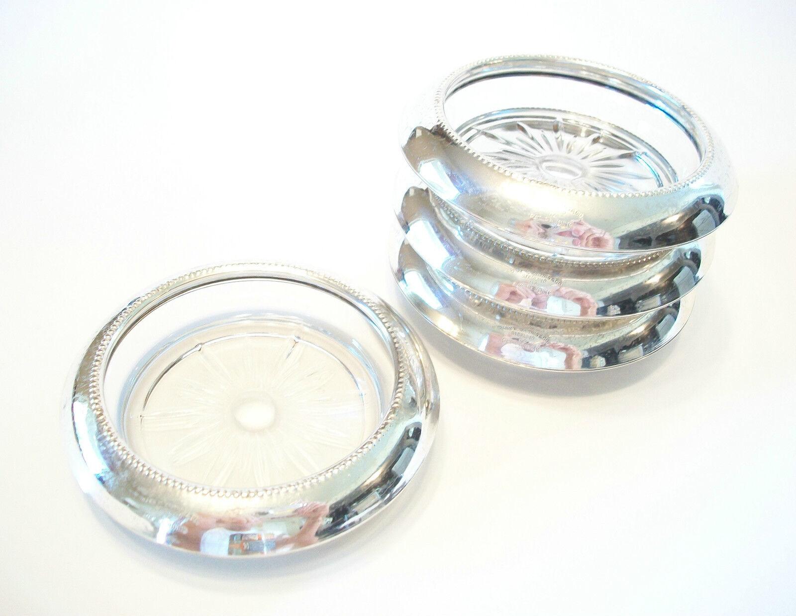 FRANK M. WHITING & CO. - Set of four vintage pressed glass coasters with sterling silver rims - stack-able - each signed - United States - mid 20th century.

Excellent vintage condition - minor dents & surface scratches from age and use - no loss -