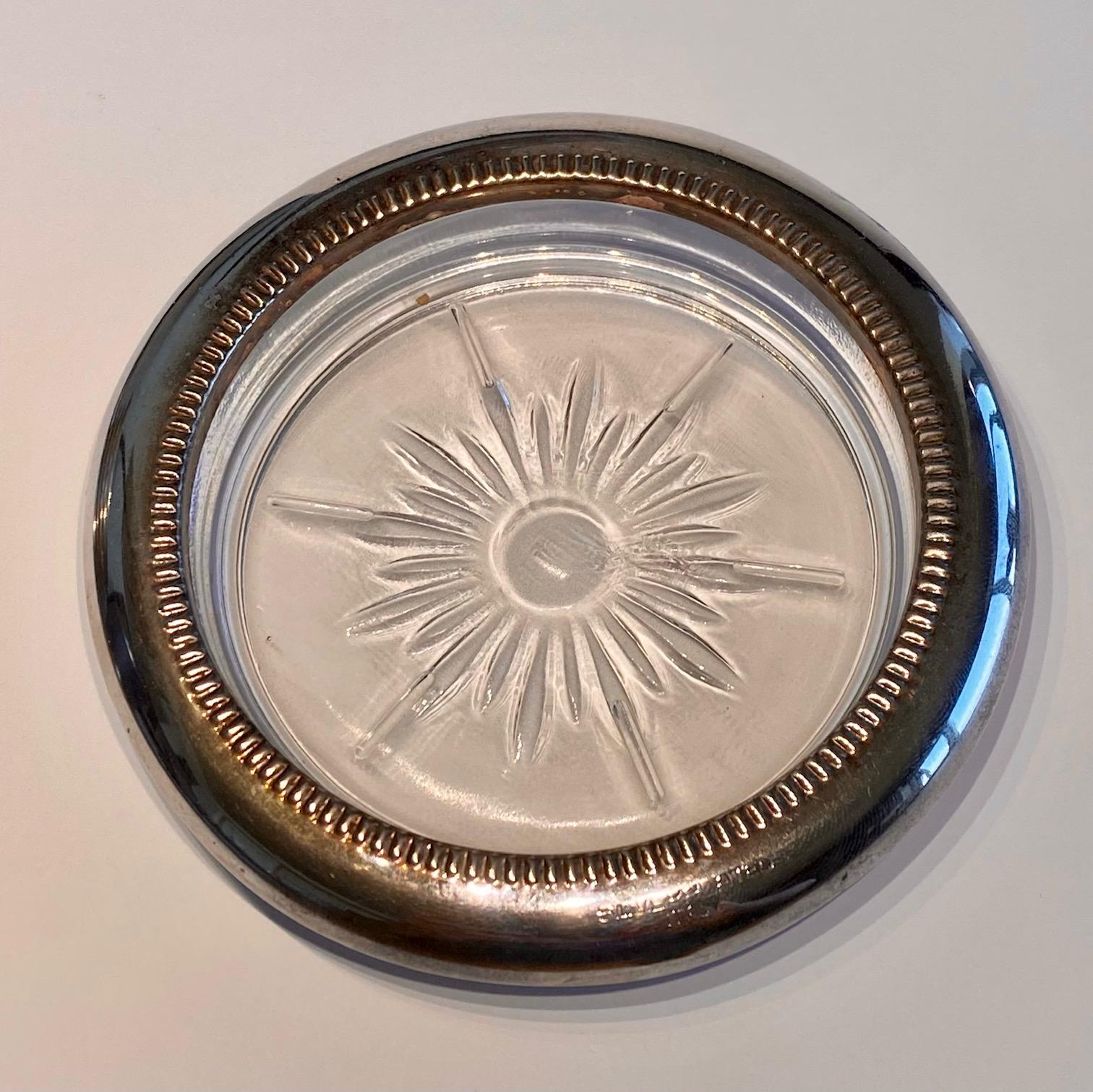 A set of 6 Crystal and Silver Plated Coasters. Mid-Century design by Frank M Whiting & Co. These are a lovely matched set of 6 with a slight patina of age. Price listed is for the set.

