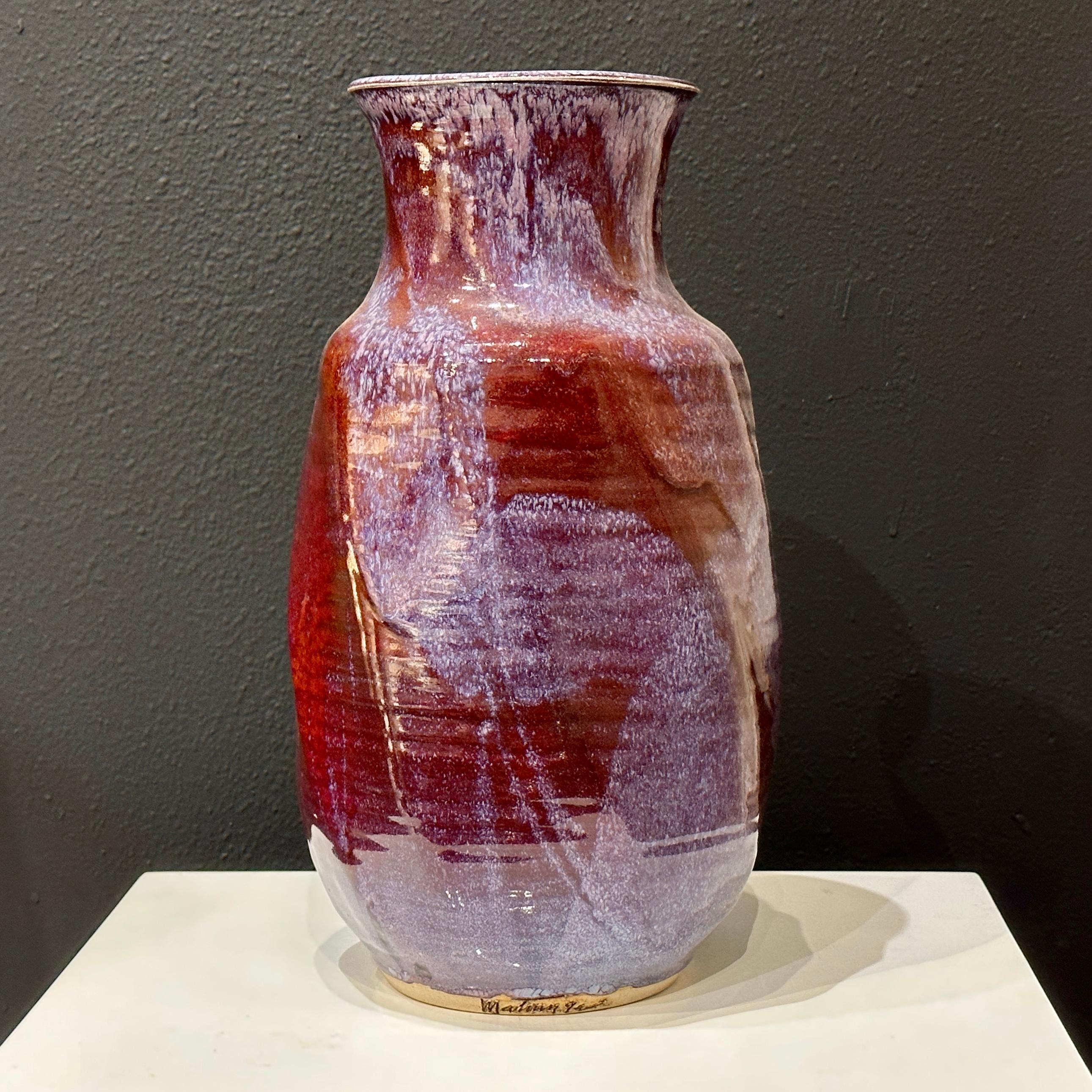 Frank Matranga Manhattan Beach California Pottery Spiral Design Vase ca 1970s. 

This glaze on this vase has a beautiful coloration including purples, reds, blues and browns, The design has an interesting twist or spiral design with ribbing. Signed