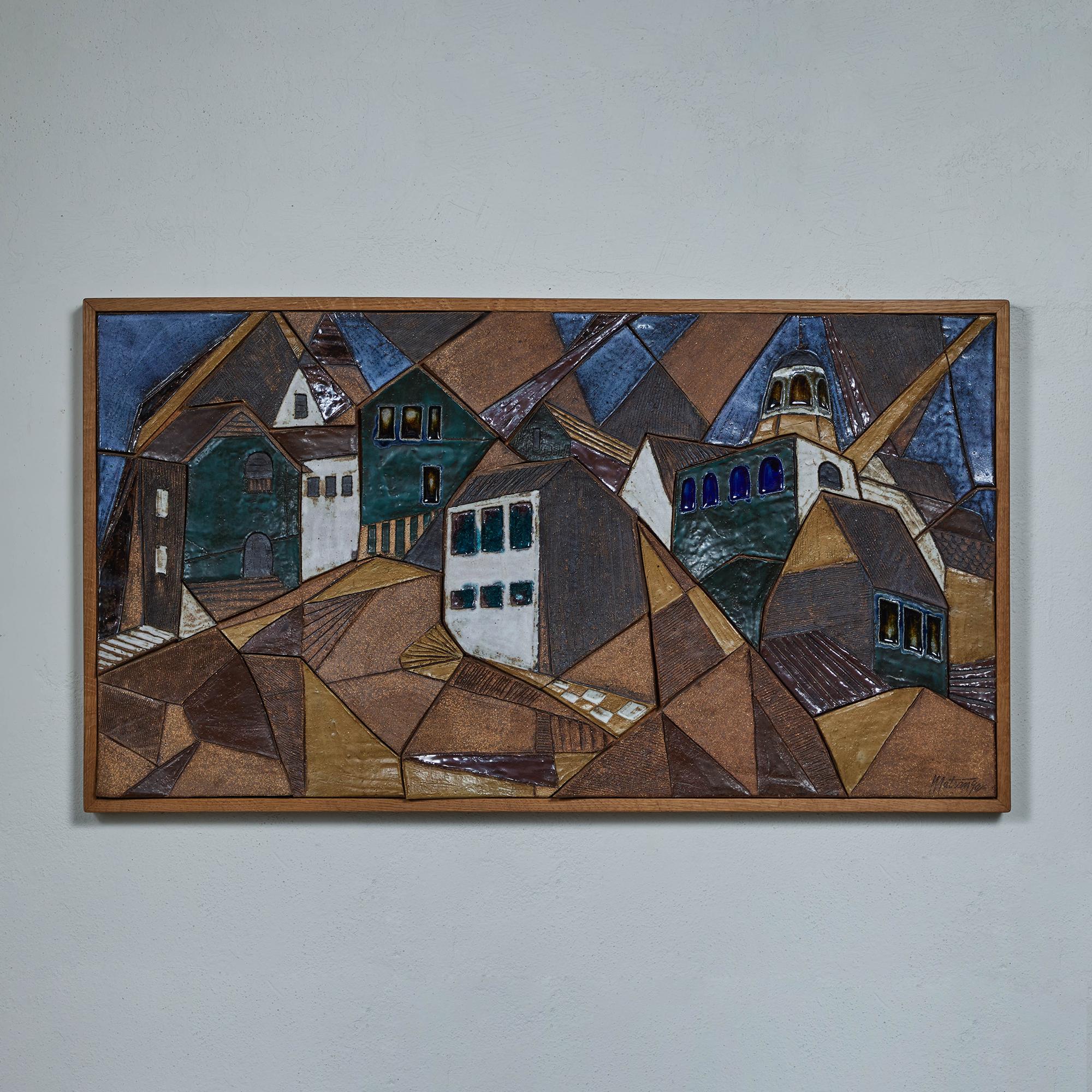 Mosaic tile art piece by California ceramicist Frank Matranga, c.1960s, USA. This piece is composed of varying shaped glazed ceramic tiles to create a mosaic cityscape. The colors range from blue to green, and neutral brown tones and set in a wood