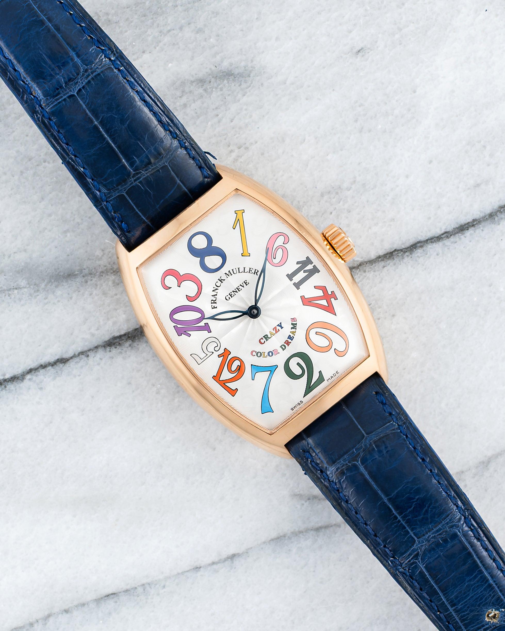 Here’s a Franck Muller reference 7851 automatic “Crazy Hours” in 18k rose gold with a bold Color Dreams dial housed in a beautifully curved rose gold tonneau-shaped case from 2012. Measurements include a 35x48mm case size and 18mm lug width. On its