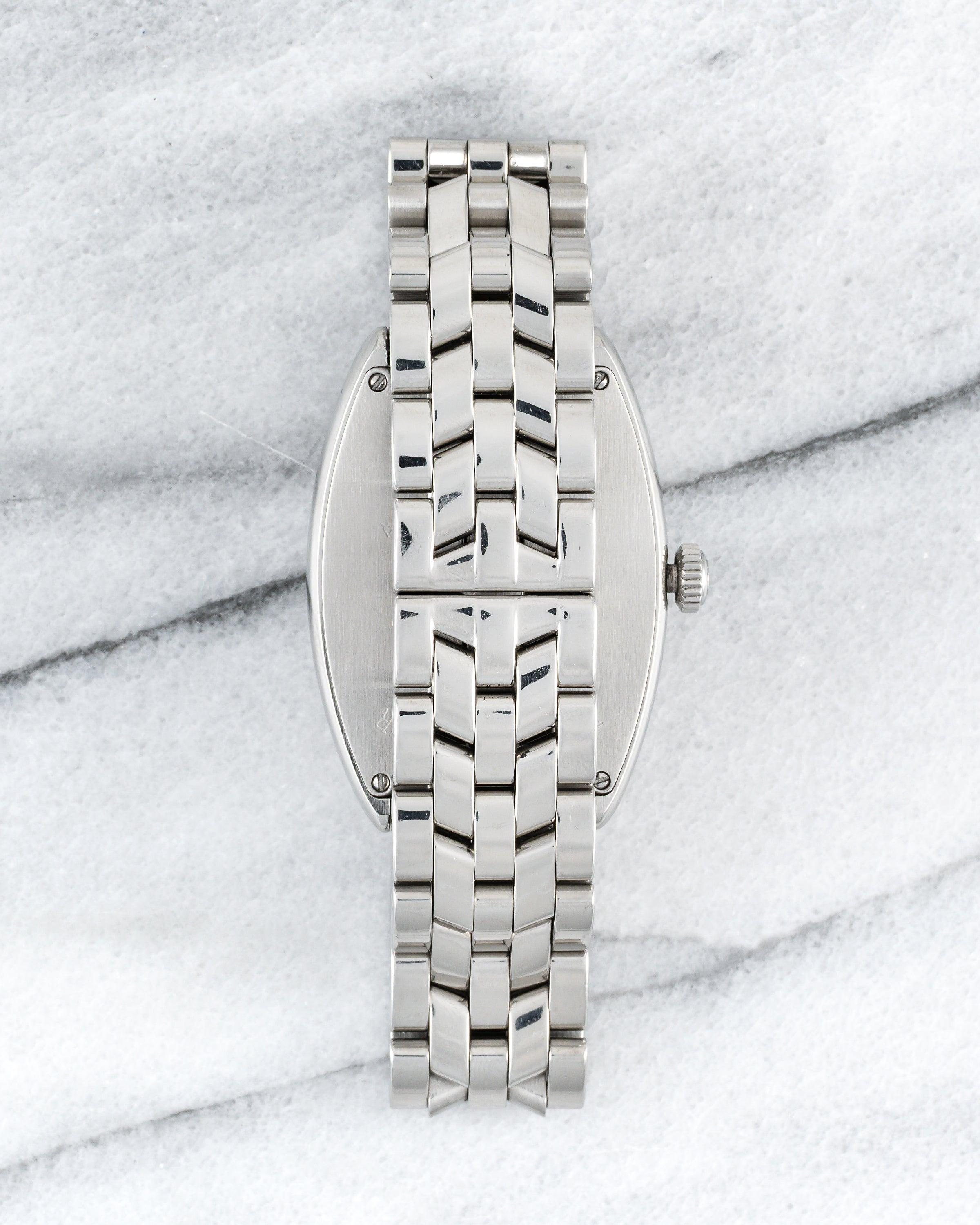 Aquí tienes un Franck Muller referencia 2852 Master Banker automático con esfera gris habana de la década de 2000. Las medidas incluyen un calibre de caja de 31x43 mm y un ancho de orejeta de 18 mm. La pulsera se ajusta a una muñeca de hasta 7,25