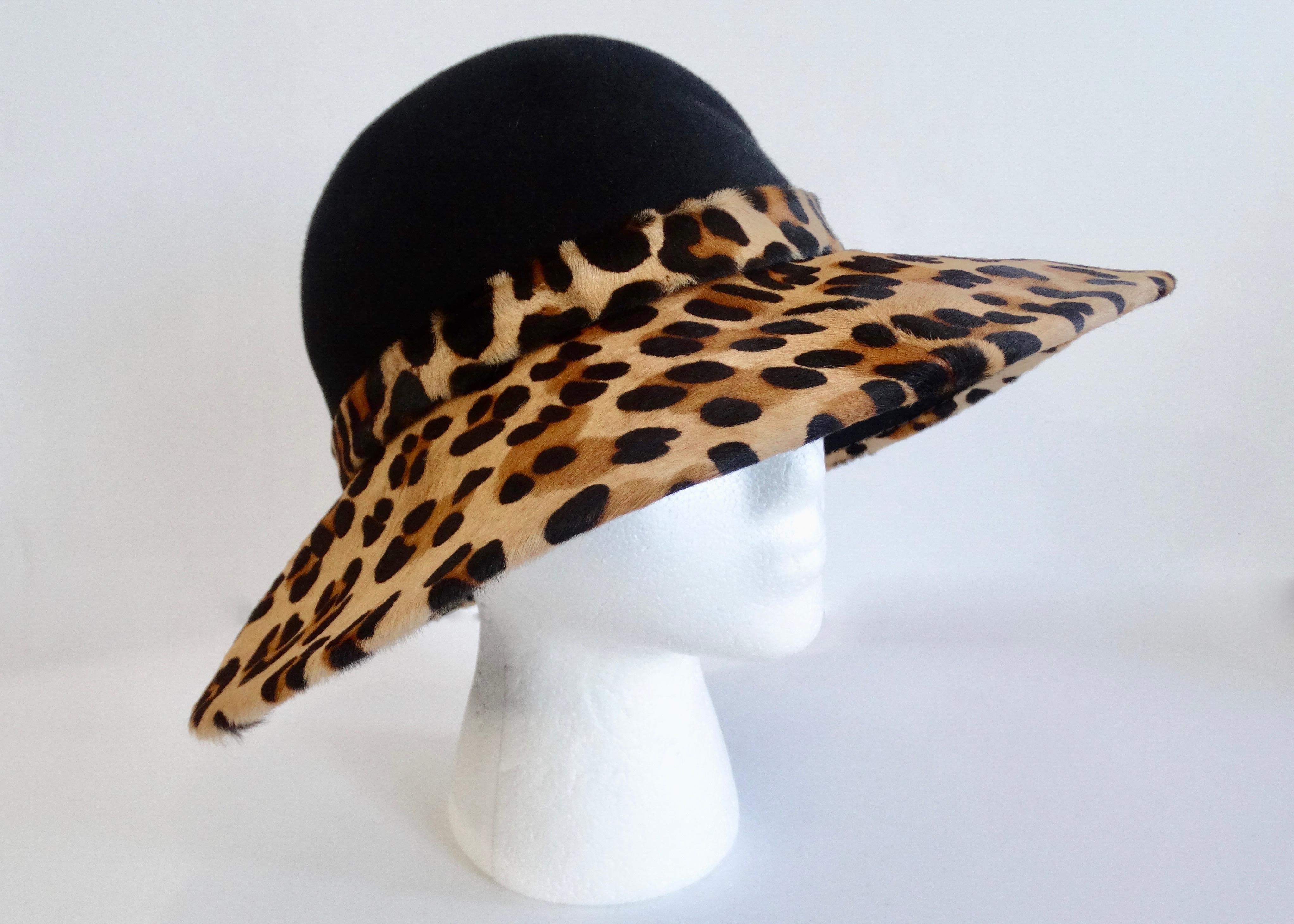 Add to your collection with this adorable Frank Oliver hat! Circa late 20th century, this hat features a black felt top and a leopard print cowhide brim. Chic and timeless, this hat is perfect all your getaways and day trips! 