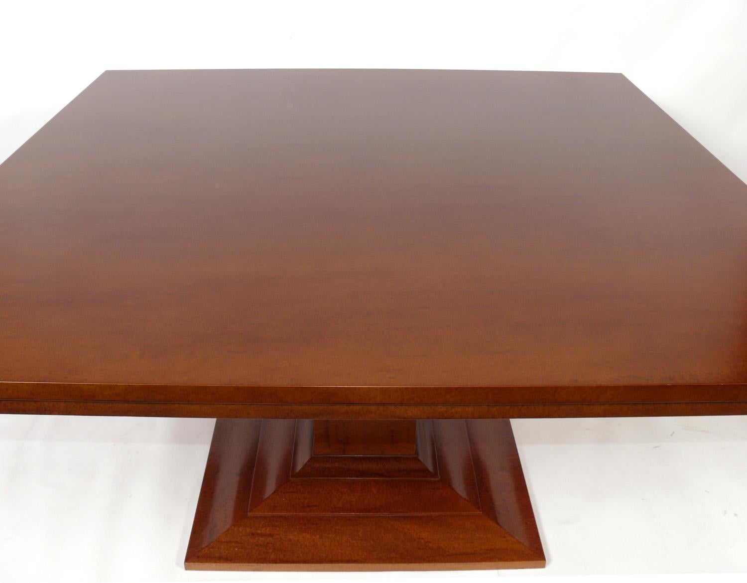 French Art Deco style custom dining table, hand made by Frank Pollaro, American, circa 2000. This custom dining creation, made of hand rubbed plum pudding mahogany, originally retailed for $12,000 in 2000. It seats 8 people, two on each side.