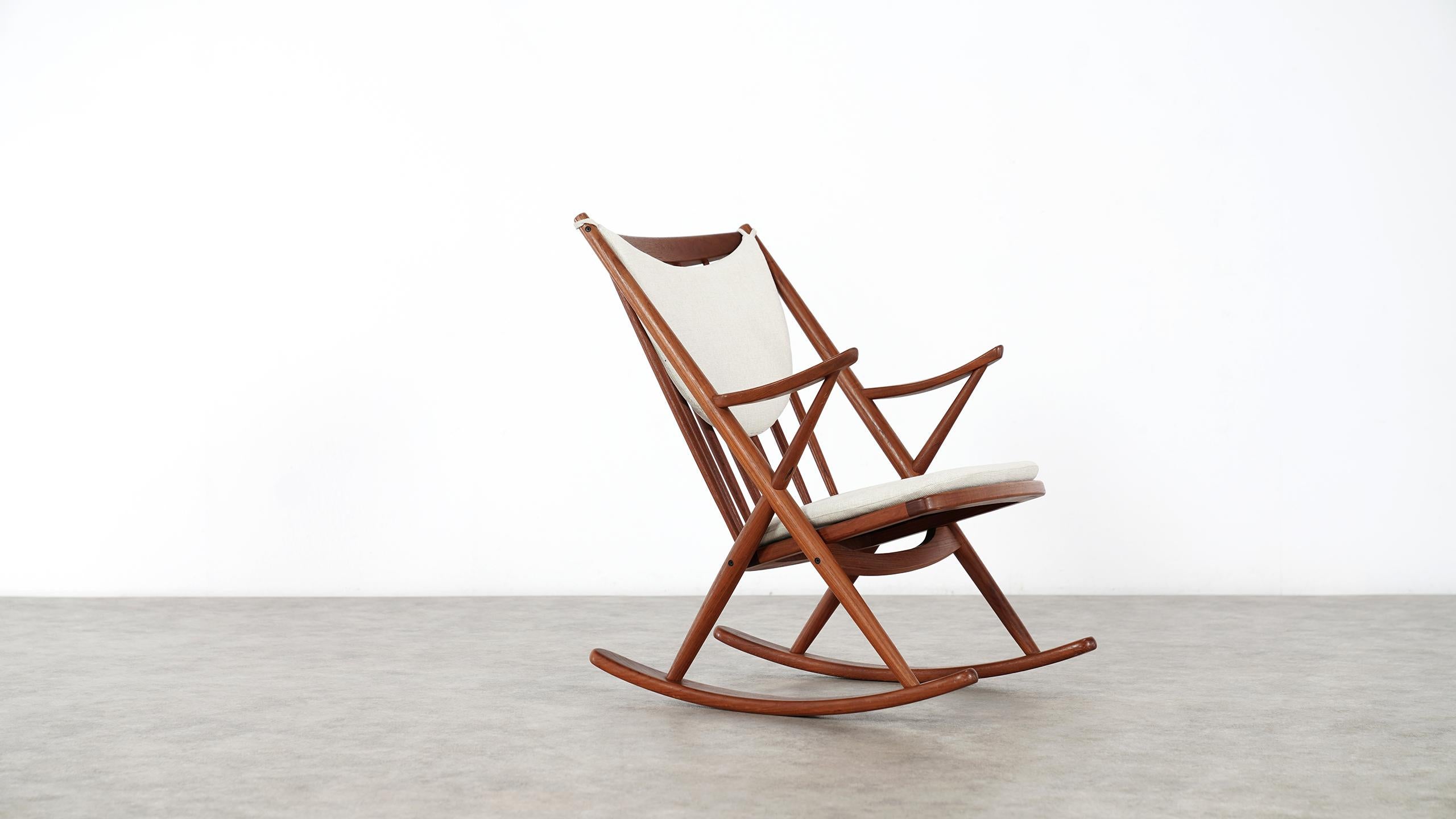 Danish modern teak rocking chair by Frank Reenskaug for Bramin Møbler

Comfortable rocking chair designed by Frank Reenskaug for Bramin Møbler in Denmark, circa 1960s.
Features a teak wood frame with six vertical spindles on the open back for
