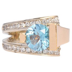 Frank Reubel, bague en or jaune 14 carats, topaze bleue et diamants sertis en canal 0,39 TCW