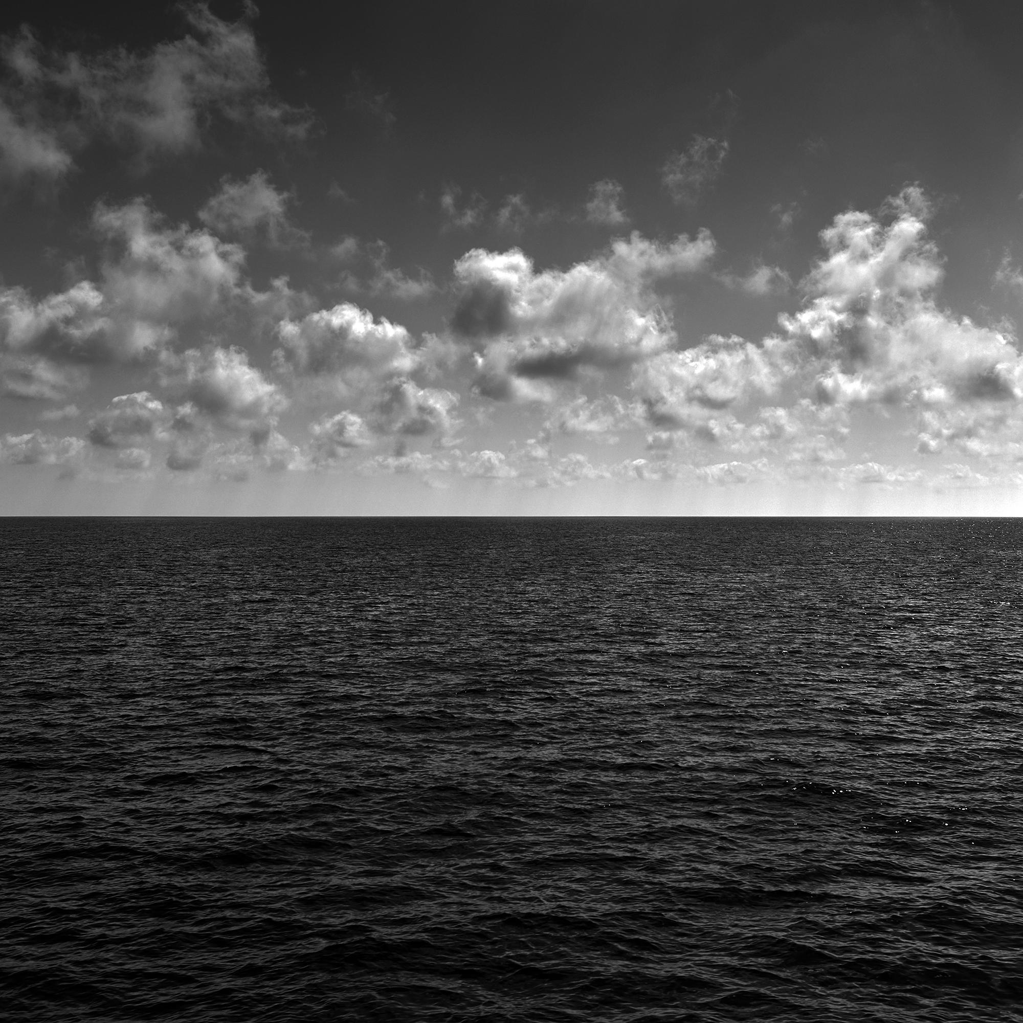 Frank Schott Black and White Photograph - Seascape VII - large format photograph of cloud formations and reflecting sea