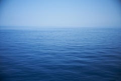Seascape X - large format photograph of monochrome blu water surface and horizon
