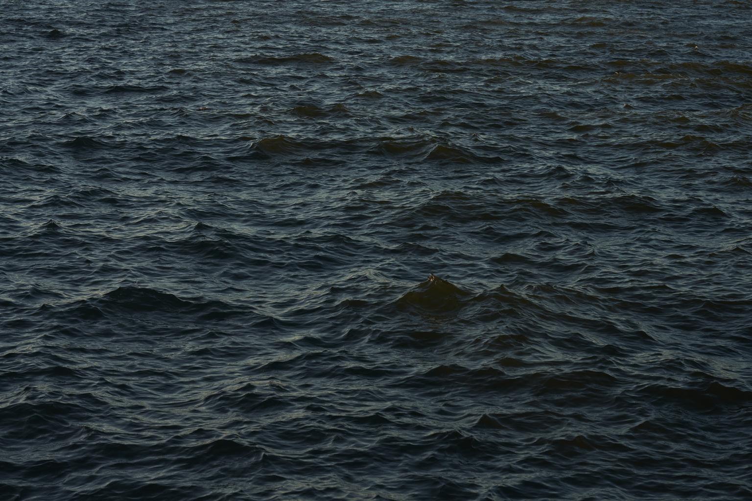 Seascape XII -large format photograph of monochrome blue water surface and Cloud