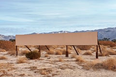 Sign of the Time - large scale photograph of iconic billboard in desert scenery