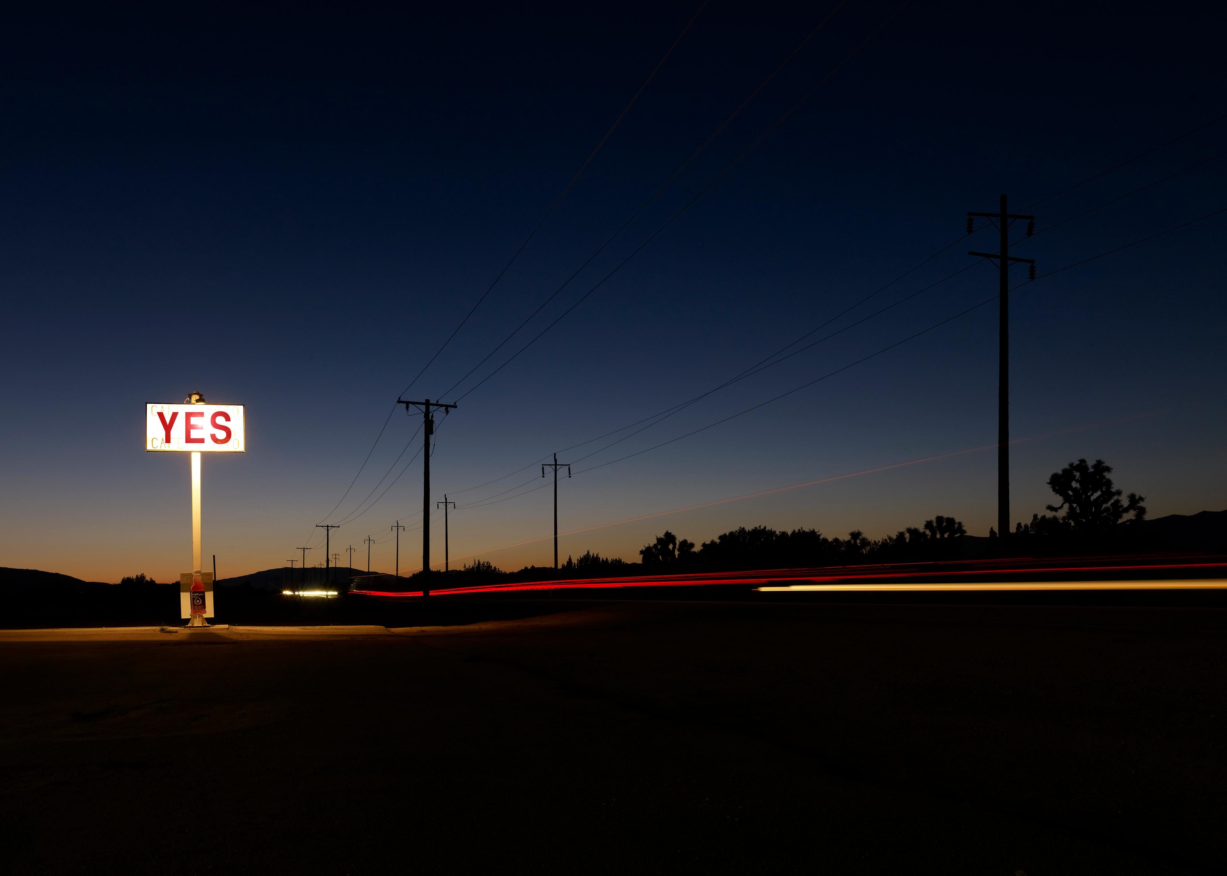 Frank Schott Landscape Print - YES - large format photograph of conceptual motivational sign at night