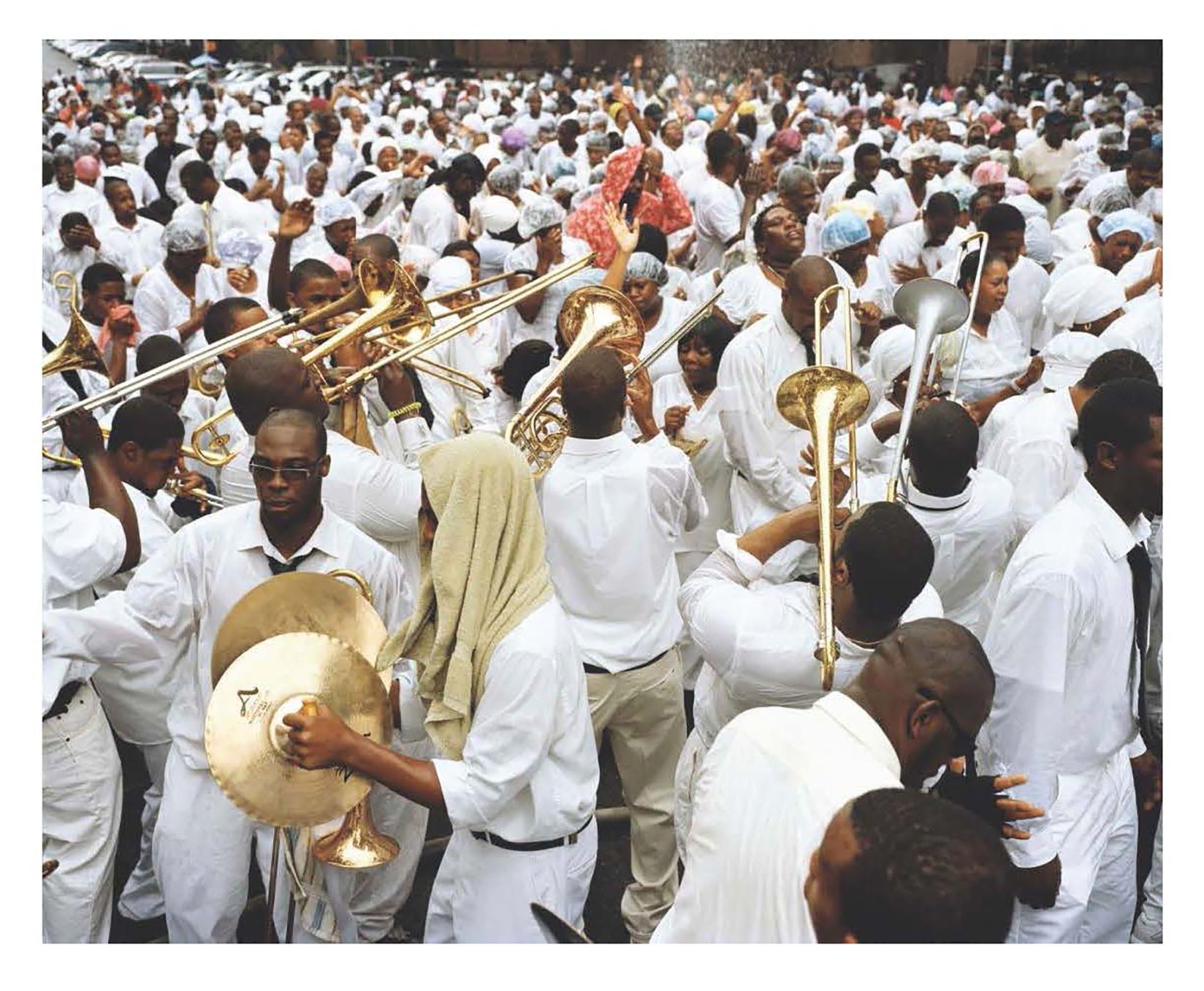 'God's Trombones' by American photographer Frank Stewart, 2009. Printed later. Pigment print, 20 x 30 inches. This photograph features Harlem during the baptism in the street, an annual occurence in East Harlem. 

For the past three decades, Stewart