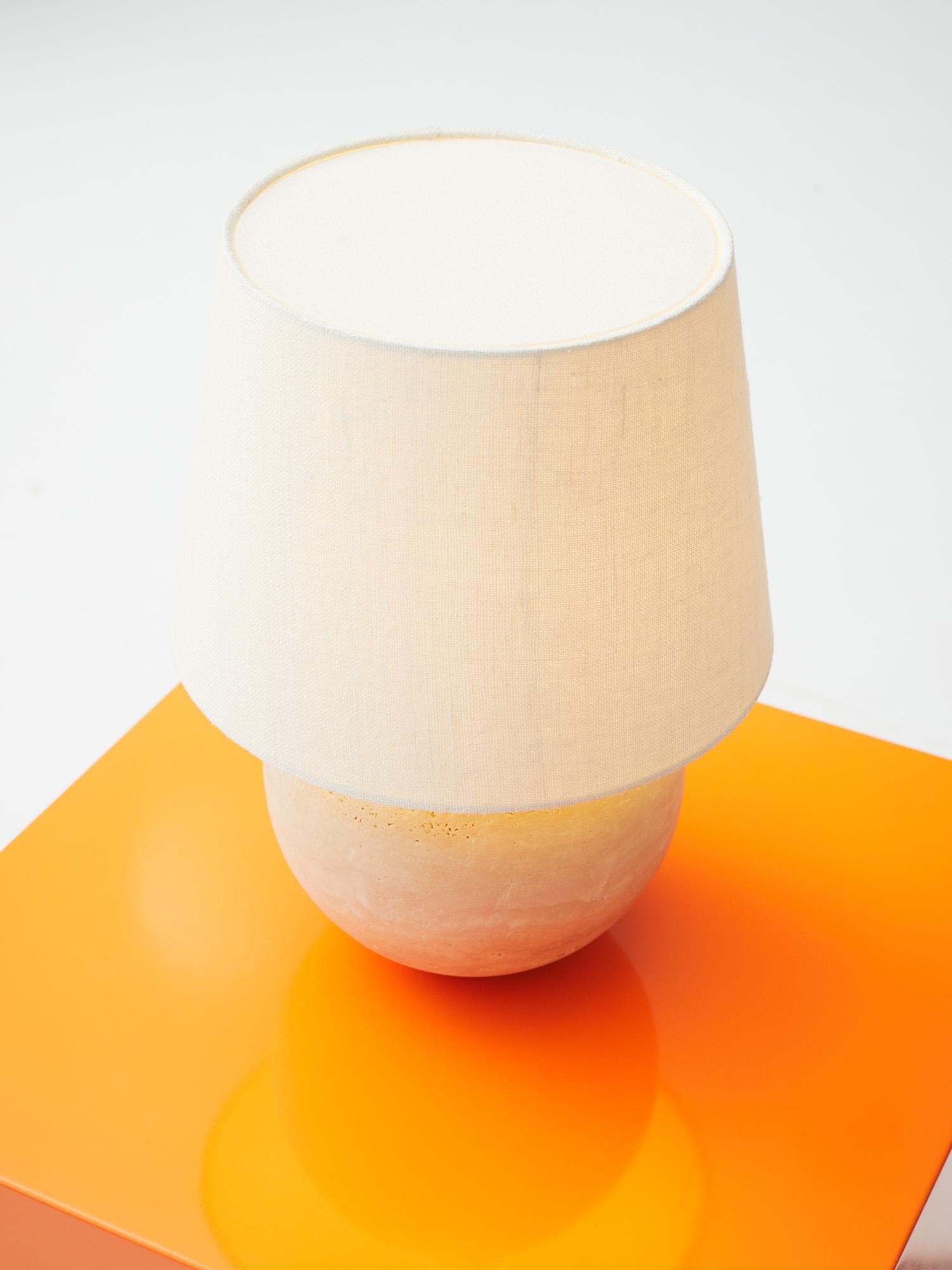 Frank table lamp medium in travertine stone. Lamp shade in 100% silk, col. Cream
Designed by Lousie Liljencrantz, Interior Designer based in Stockholm Sweden. 
Made in Sweden/ Italy

Dimmable
The lamp is calibrated for a Classic LEDLuster