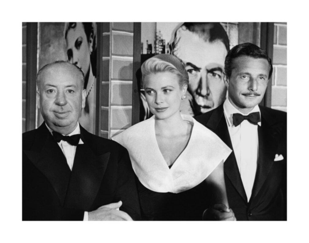Frank Worth Black and White Photograph - Alfred Hitchcock, Grace Kelly, and Oleg Cassini at the Premier of Rear Window