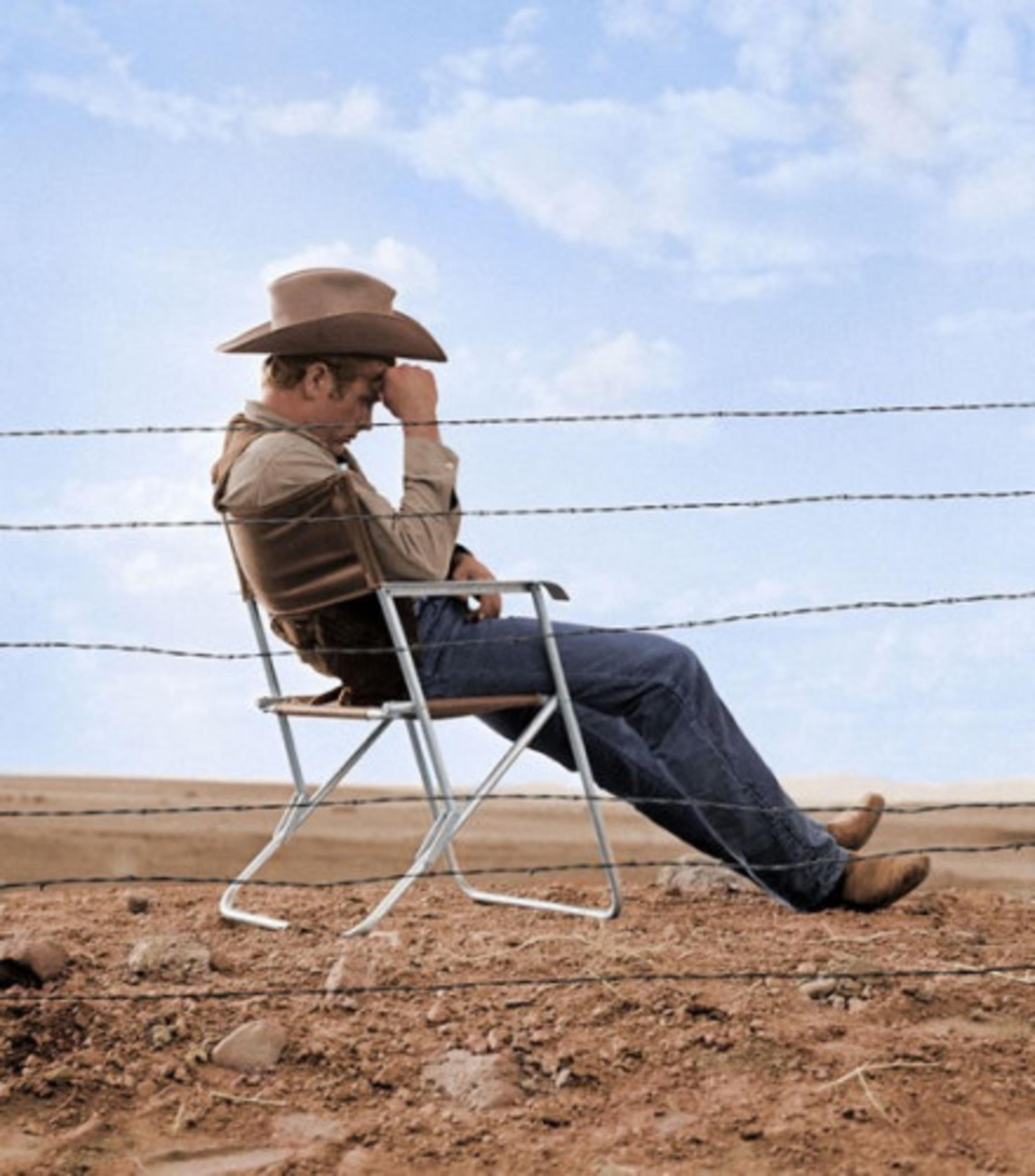 James Dean seated - Photograph by Frank Worth