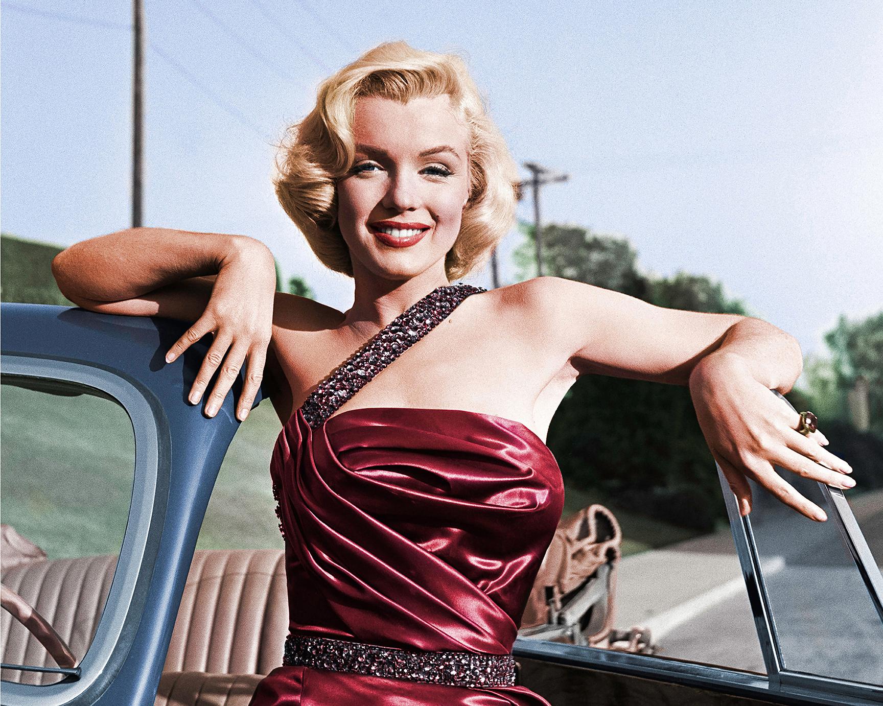 Frank Worth Color Photograph - Marilyn Monroe with Classic Roadster for "How to Marry a Millionaire"