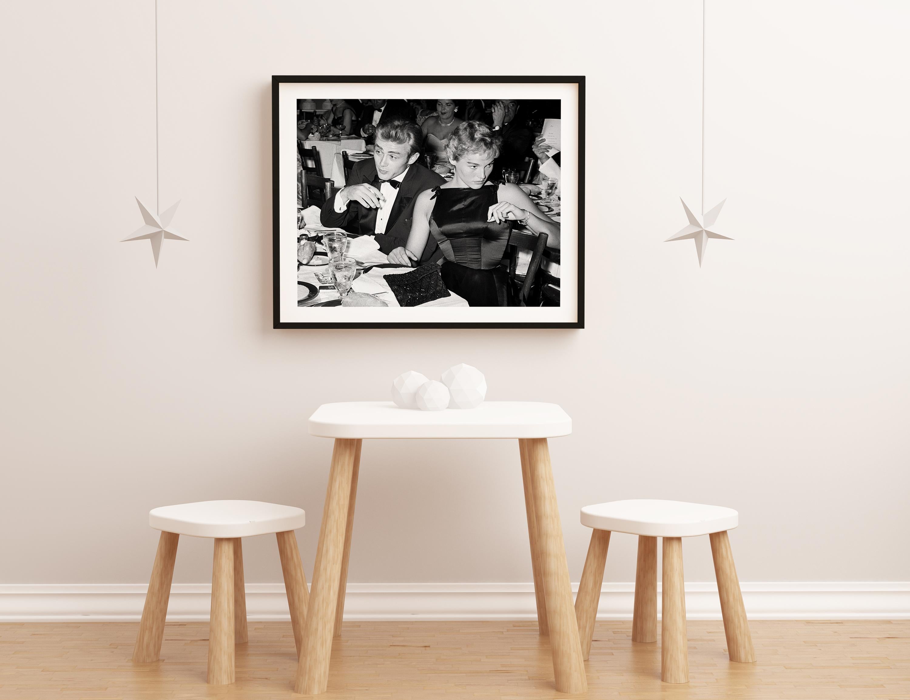 James Dean and Ursula Andress at Oscar Dinner Fine Art Print - Black Black and White Photograph by Frank Worth