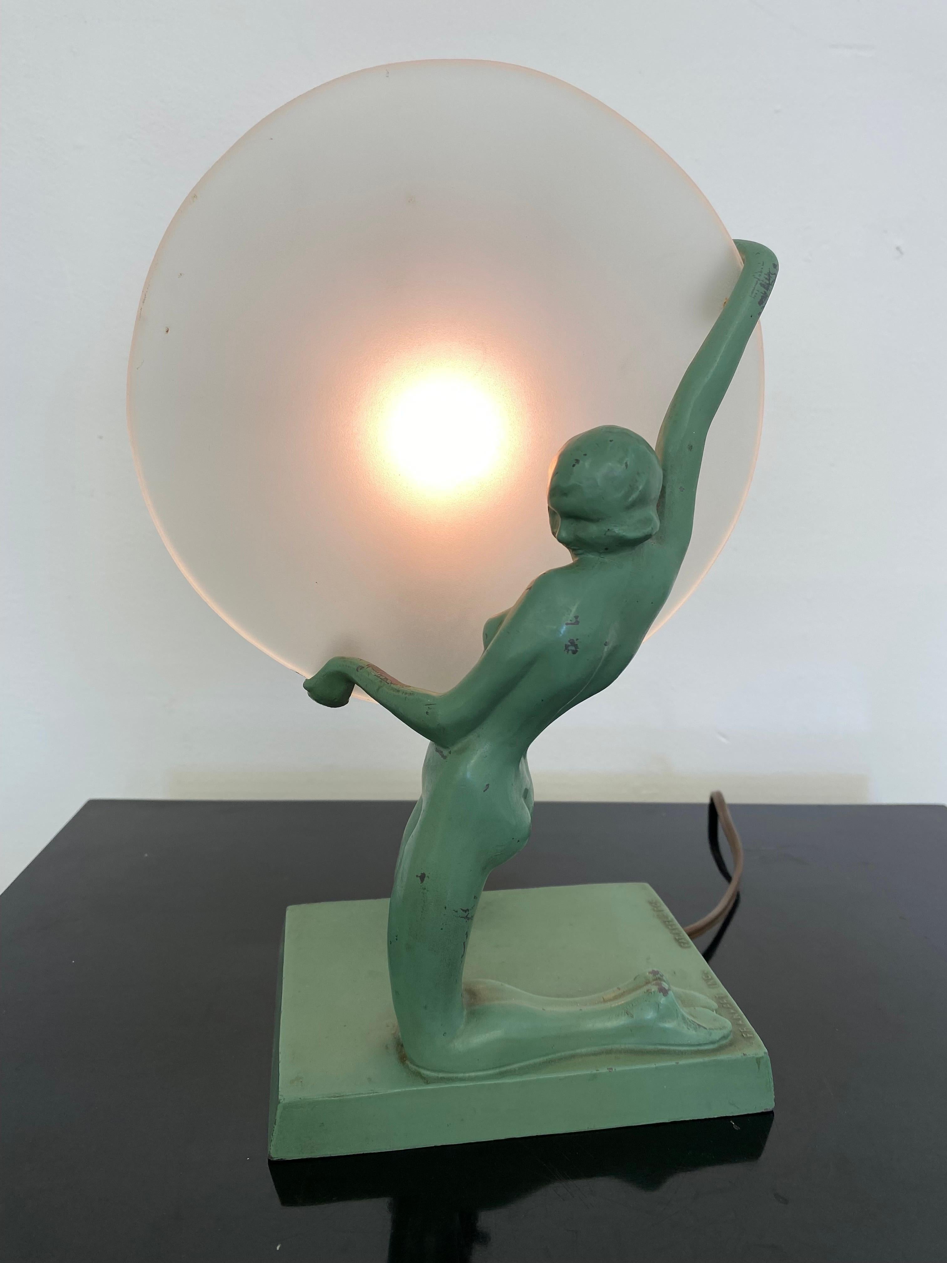 Frankart Kneeling nude lady table lamp, Model L247. Harder to find model! Retains Original Paint! Shows some minor losses to finish. Probably a later replacement Glass Pane. Great looking, signed to bottom edge.
