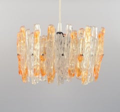 Franken Kalmar, Germany. Ice Glass Pendant in Orange and Clear Acrylic Glass.