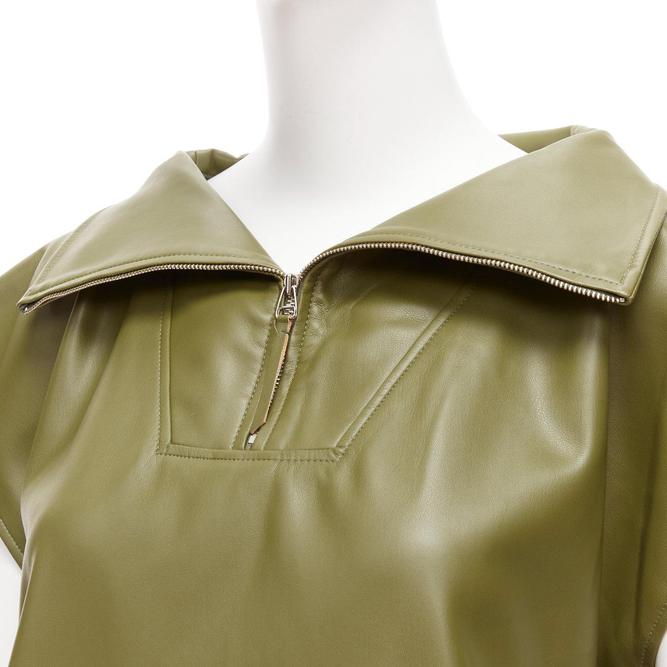 FRANKIE SHOP khaki green faux leather PU half zip boxy popover sleeveless top XS
Reference: AAWC/A00633
Brand: Frankie Shop
Material: Acetate
Color: Green
Pattern: Solid
Closure: Zip
Extra Details: Half zip at collar. Slit side pockets.
Made in: