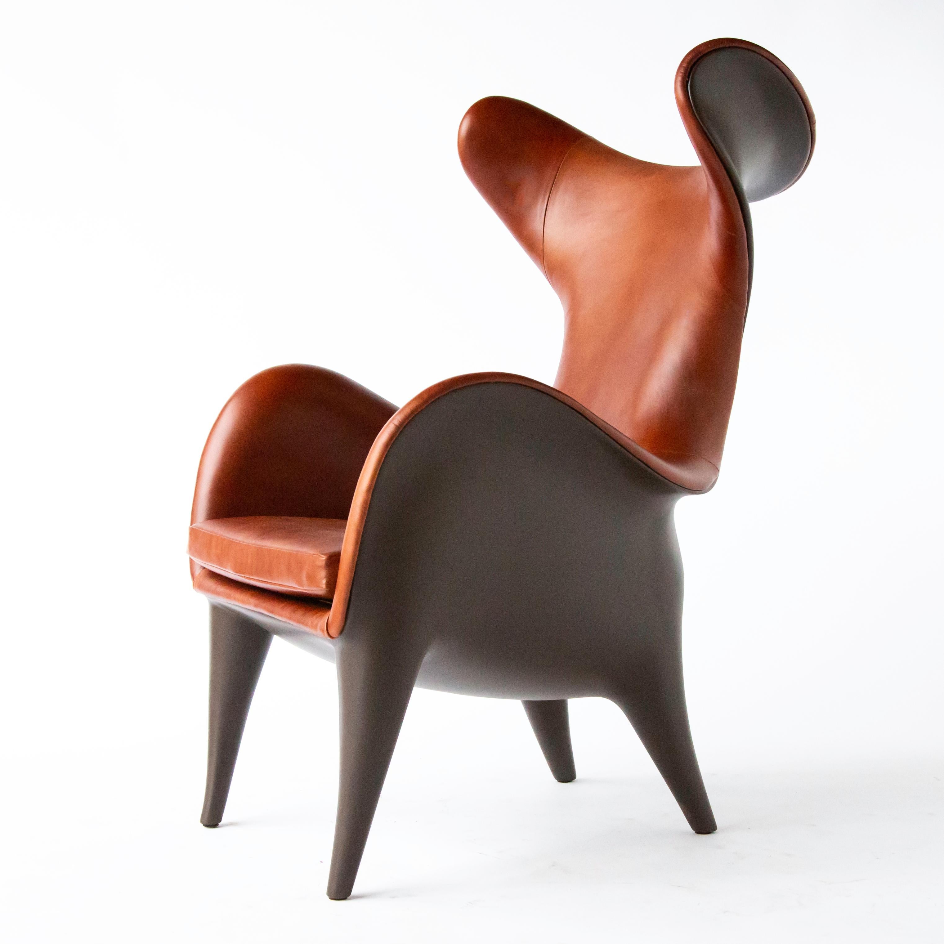 New Johnny wingback chair or lounge chair, deep Bourbon leather and chocolate resin, made in Chicago. Jordan Mozer (b. 1958). 

Frankie and Johnny lounge chairs were created for Hotel 57 in New York in 2007. This version was created in 2019.