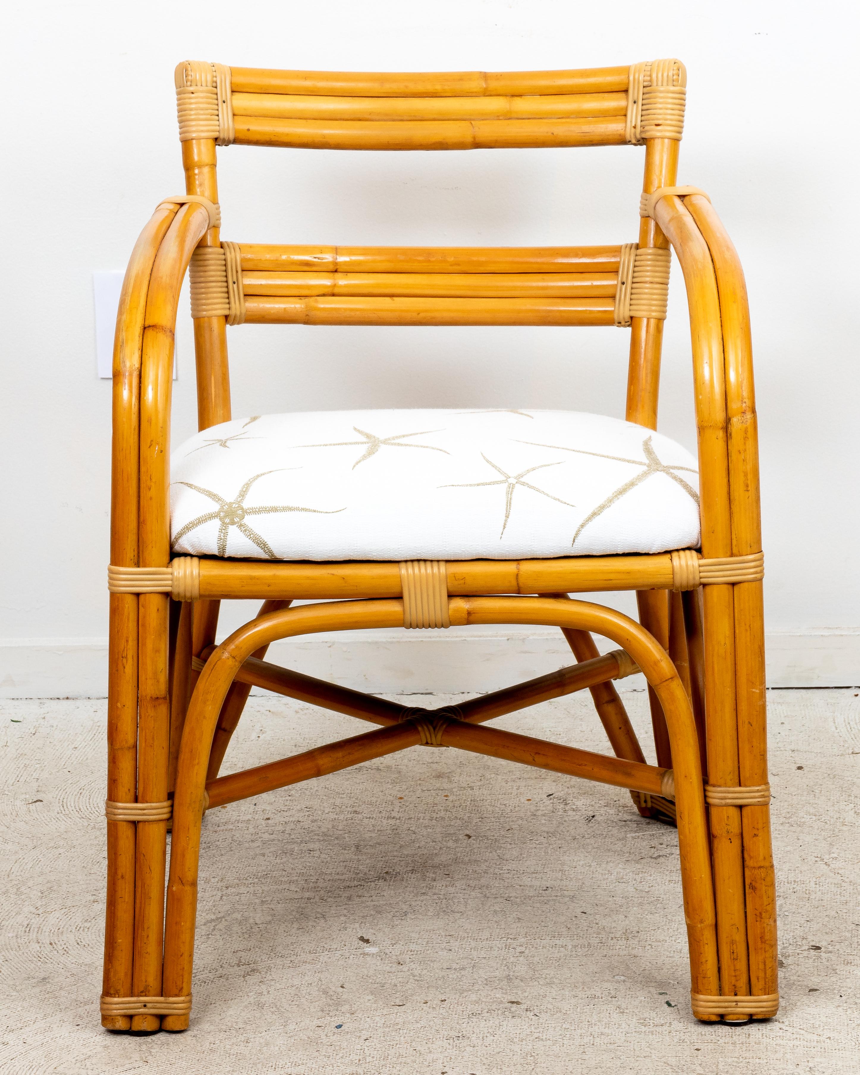 Paul Frankl style bamboo rattan arm chair with new Starfish upholstery. Slight wear to frame finish.