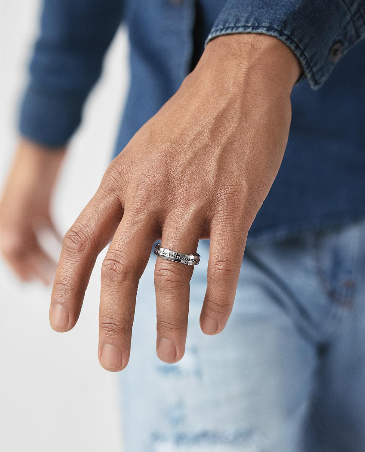 The cutting-edge and contemporary, while simultaneously chic, design of two floating rings connected only by five signature Rockford screws and very fine attention to detail, allows this special comfort fit designer ring with 0.50ct black diamonds