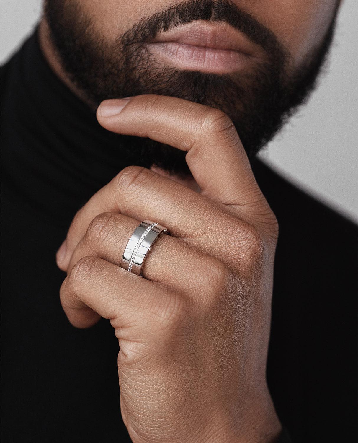 The cutting-edge and contemporary, while simultaneously chic, design of two floating rings connected only by five signature Rockford screws and very fine attention to detail, allows this special comfort fit designer ring with 0.50ct white diamonds