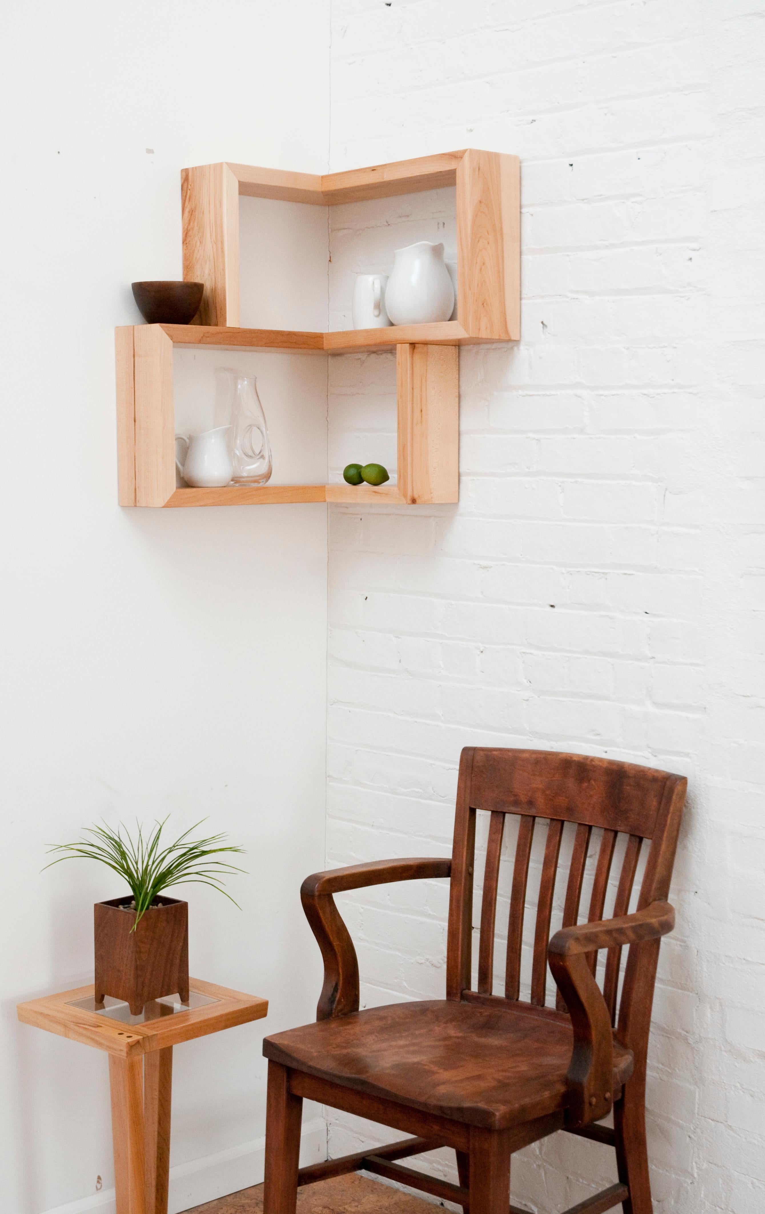 The award nominated Franklin Shelf is a 90 degree corner shelf. This unique design allows for maximum storage space, while occupying a very small area. The smooth wooden finish of this shelf will make a great addition to any corner, table, or