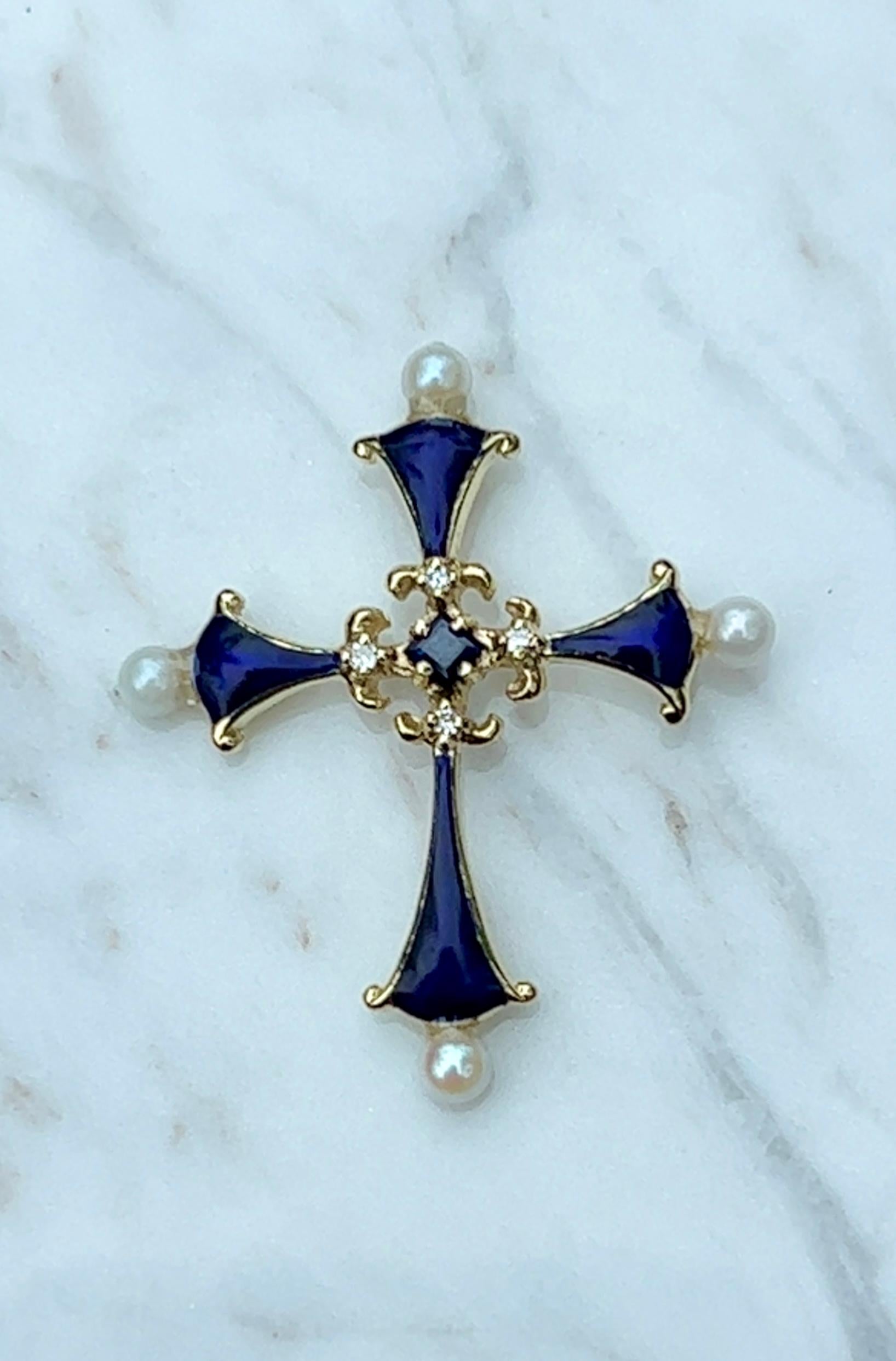 One 14k Yellow Gold Enamel Faberge Franklin Mint Sapphire Midnight Cross Pendant. This vintage 14k yellow gold enamel sapphire midnight cross pendant, an original design by the house of Igor Carl Faberge made for Franklin Mint in 1983. Featuring a