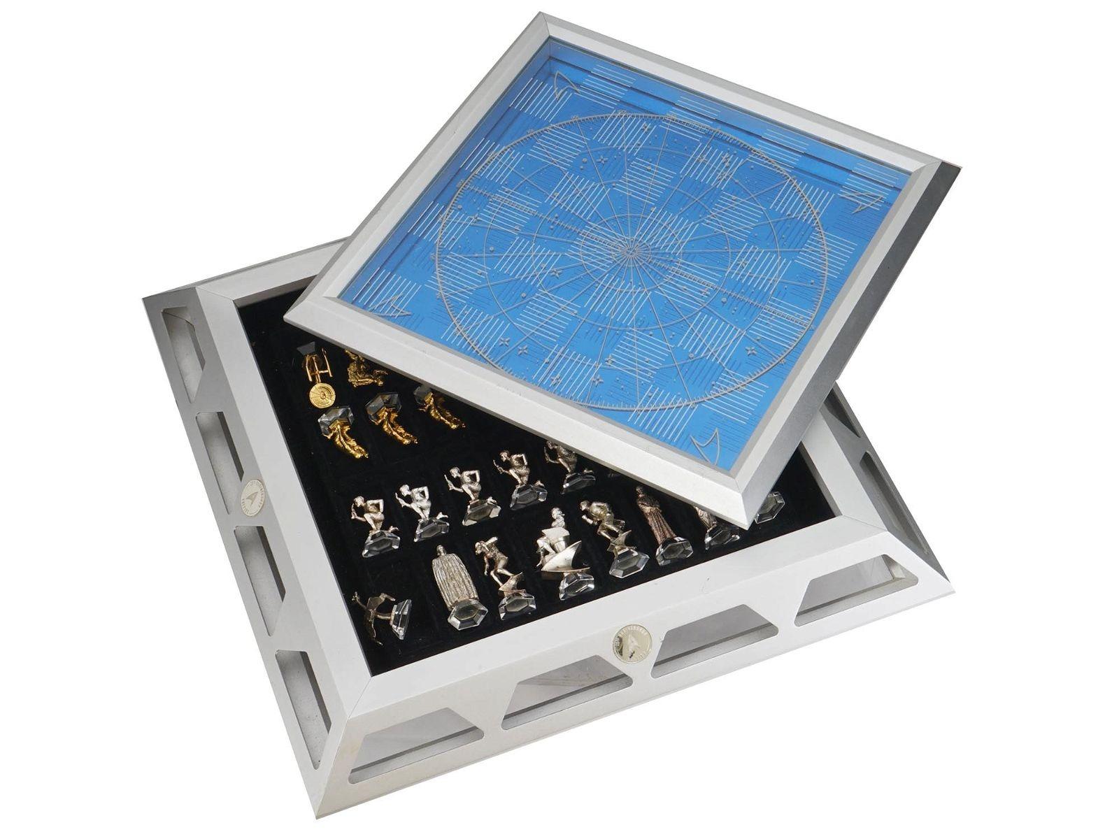 Commemorative Star Trek chess set by Franklin Mint, 25th Anniversary Special Edition, with finely crafted gold and sterling silver plated Klingon and Federation chess pieces raised on crystal bases. 