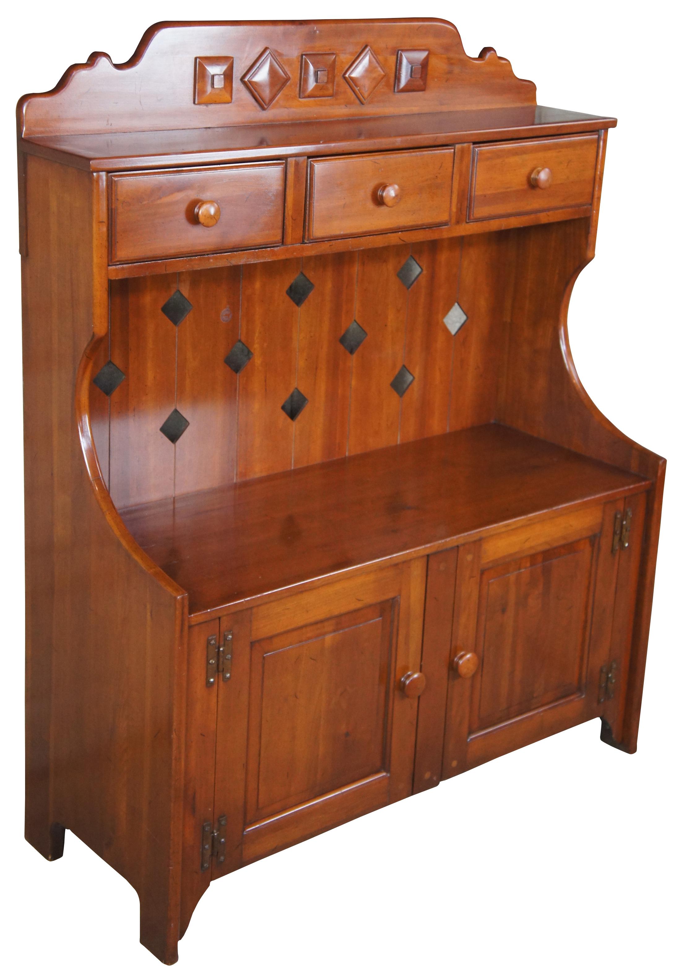 1959 Franklin Shockey hand burnished pine dry sink or bucket bench. Made from pine, with three drawers and lower cabinet. Features diamond cutout along back and shaped carving on the upper back splash. Marked Franklin Shockey along the back,