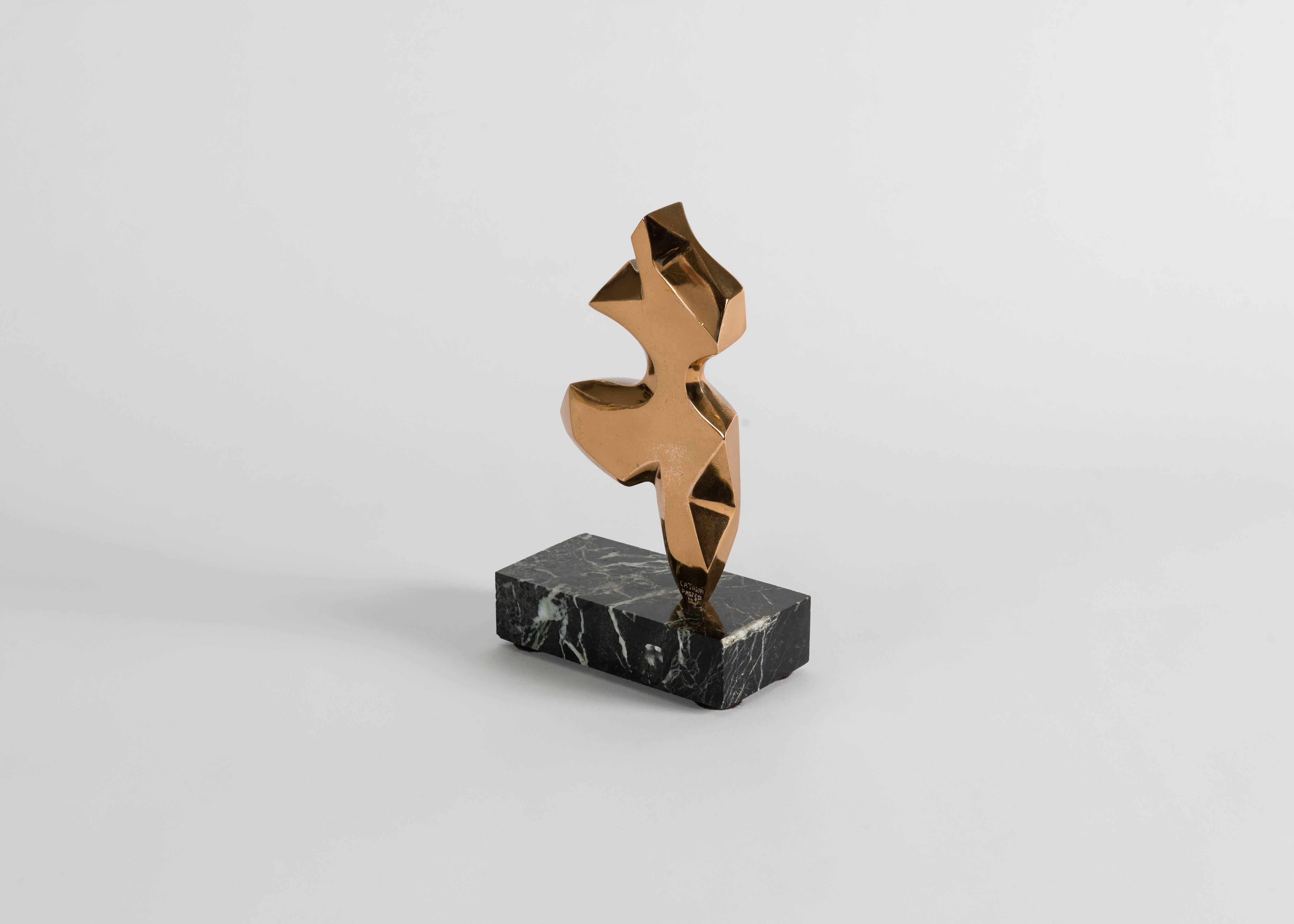 Signed and dated: Catalaa Darpeix, 1976

This remarkable bronze sculpture, which shimmers in the light above its rectangular marble base, intimates the shape and motion of a dancer.