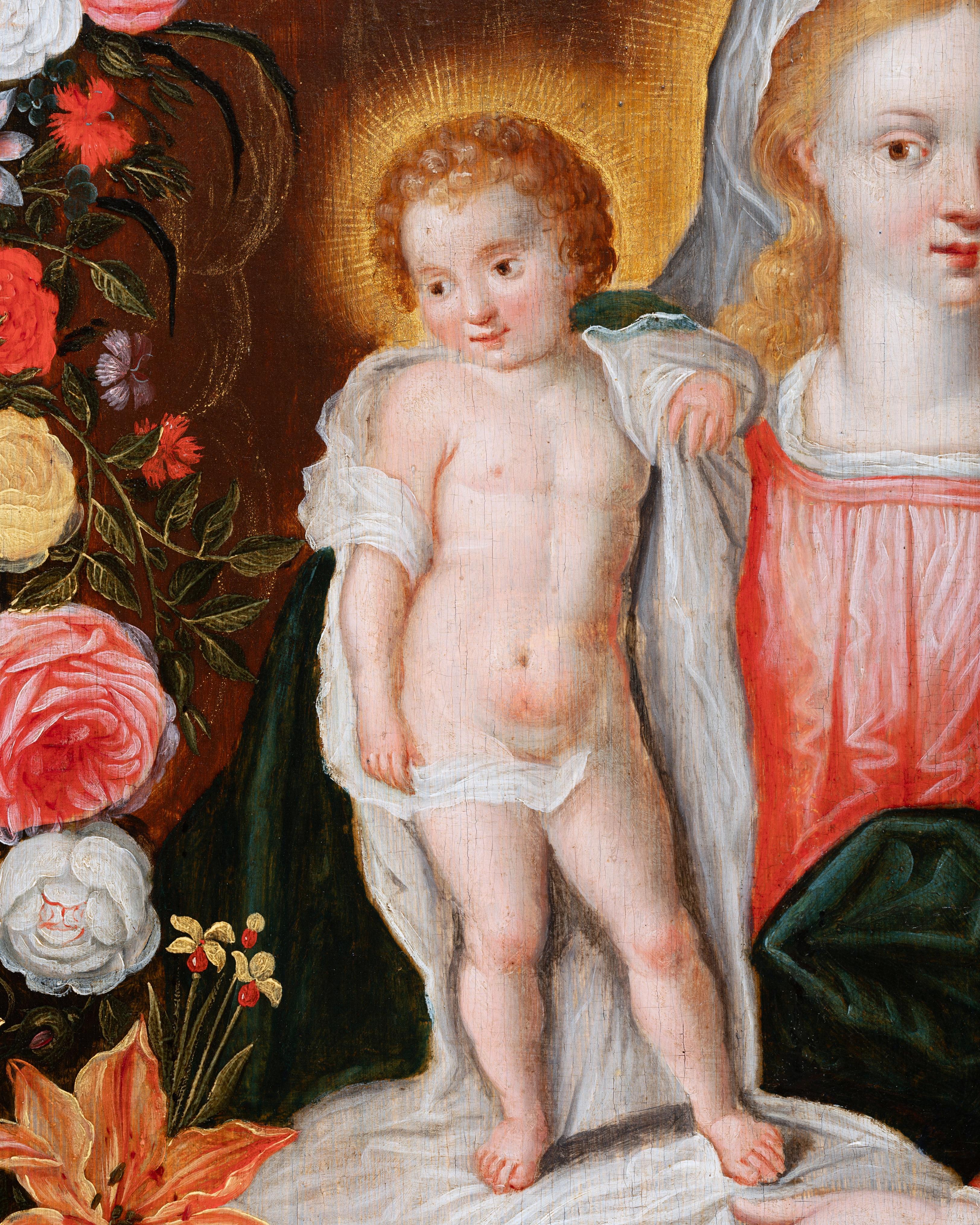 Vierge à l'enfant dans une guirlande de fleurs
Studio de Frans Francken II (1581-1642), non signé
École d'Anvers du 17e siècle
Huile sur panneau de chêne
Dimensions : h. 63 cm, l. 48,5 cm (24.80 x 19.10 in)
Un élégant cadre sculpté et
