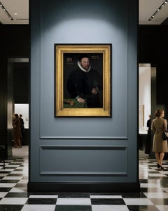 Civic Portrait of a Gentleman in a Doublet beside a Table with Clock, dated 1595
