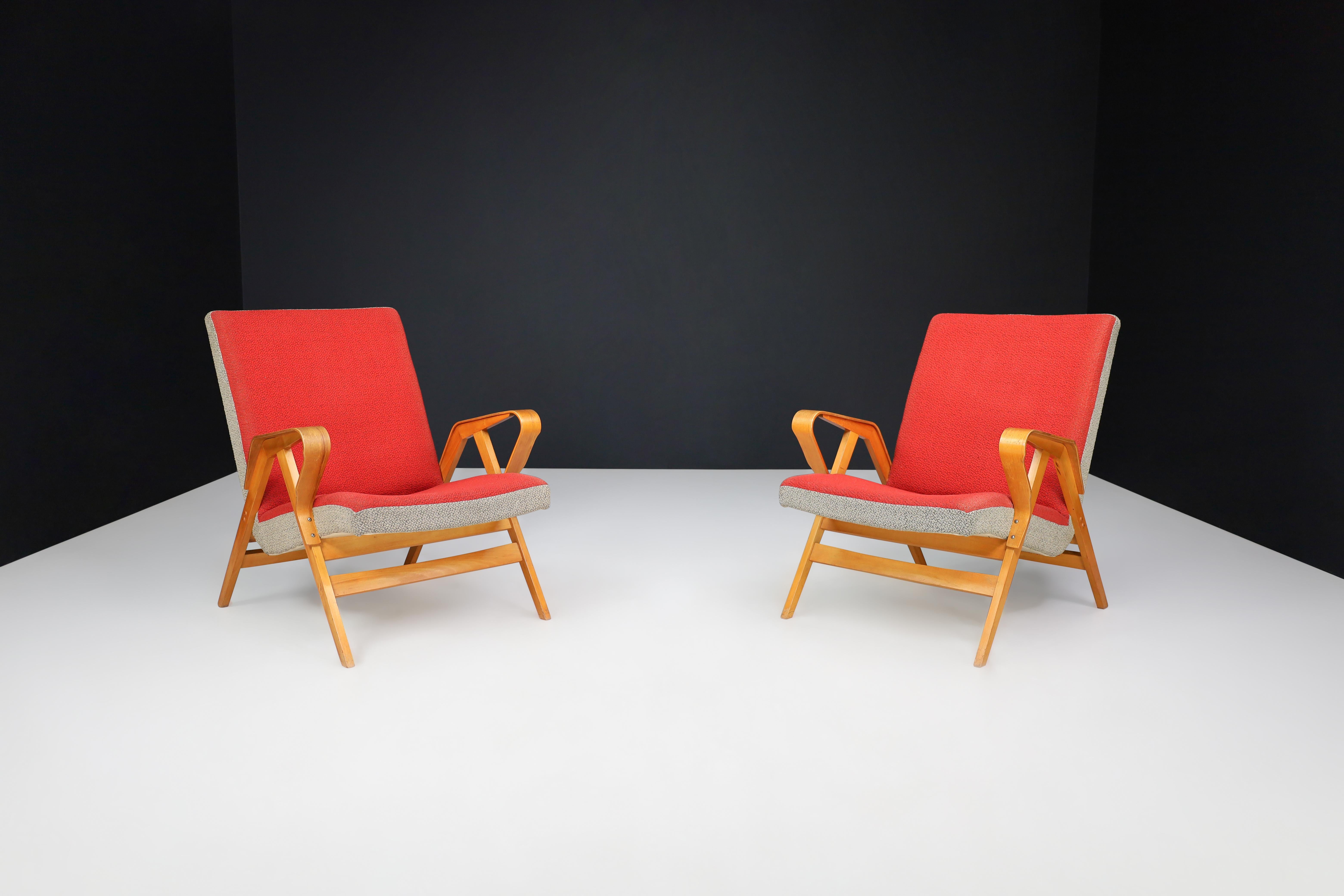 František Jirák for Tatra Nábytok lounge chairs in original upholstery, 1960s.

These lounge armchairs were designed by František Jirák for Tatra Nabytok in the 1960s, and feature original bentwood armrests and an ash wooden structure. The