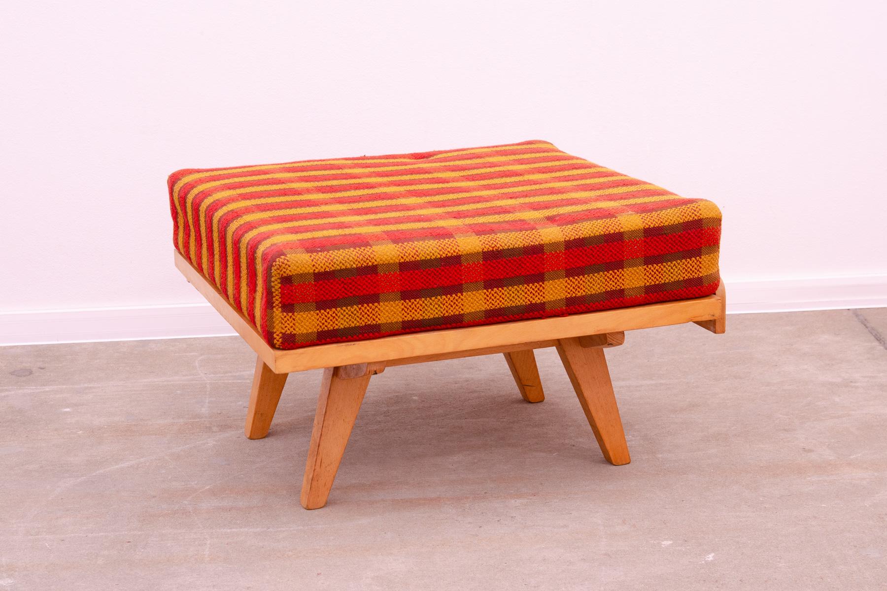 Midcentury footstool designed by Frantisek Jirak for by Tatra nabytok Pravenec, 1960´s. Made in the former Czechoslovakia.
Very stylish and modern design. Overall in good vintage condition, the fabric showing signs of age and using(the fabric has a