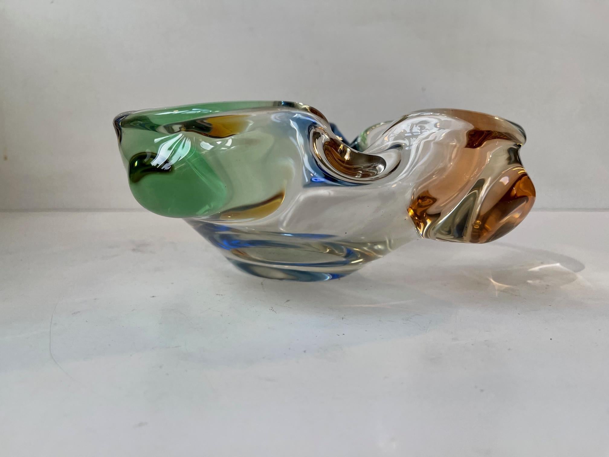 Variation of the Rhapsody Art Glass where diffrent colors of clear glass are blown together during heating. Designed by Czech glass blower Frantisek Zemek at his studio Mstisov during the early 1960s. Measurements: W: 23, D: 16, H: 7.5 cm.