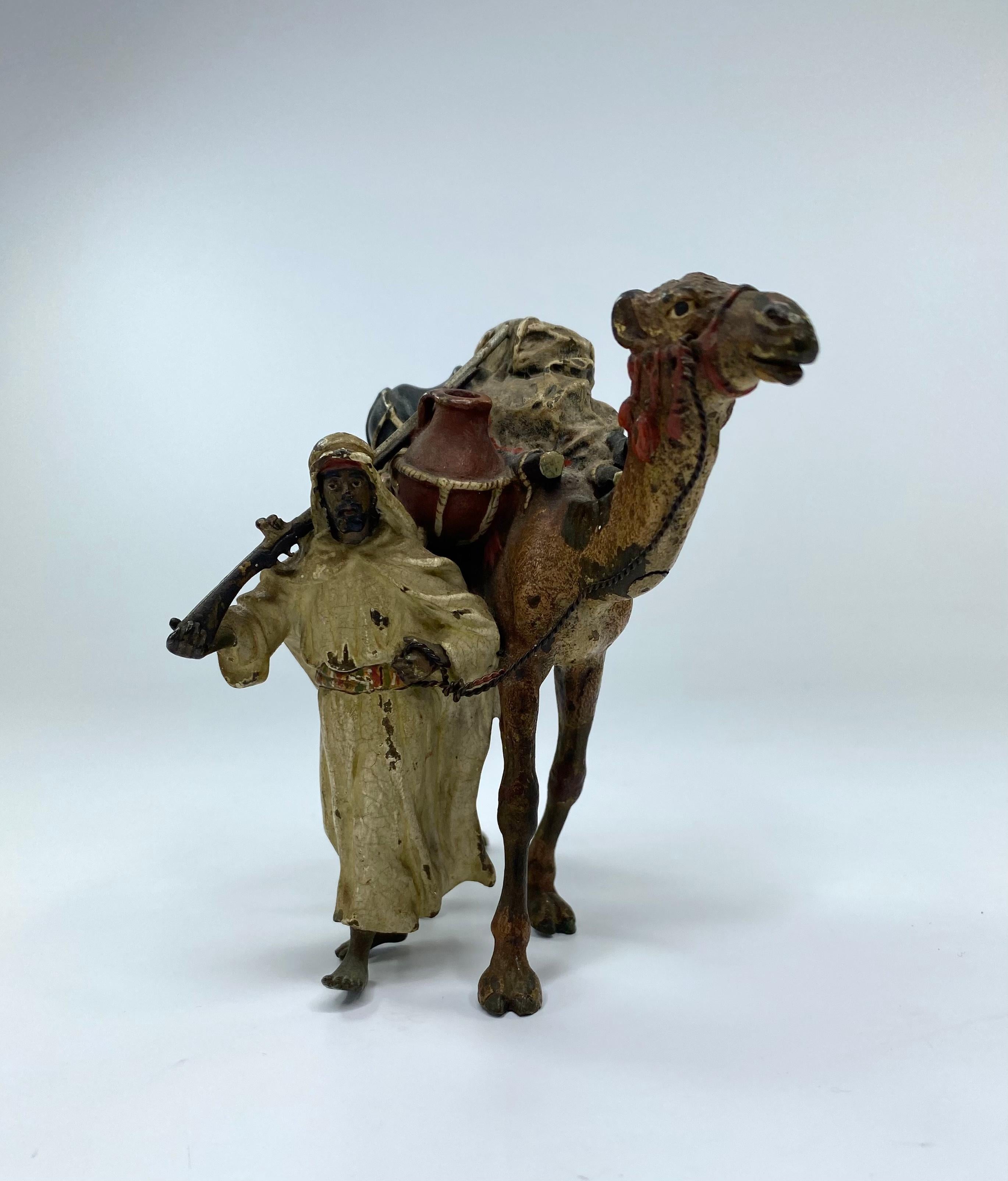 Franz Bergman, Austrian cold painted bronze study, Vienna, c. 1900. Modelled as an Arab hunter, walking alongside his camel, and carrying a rifle. His possessions loaded upon the camel. Naturalistically painted in enamel colours.
Stamped ‘B’ in an