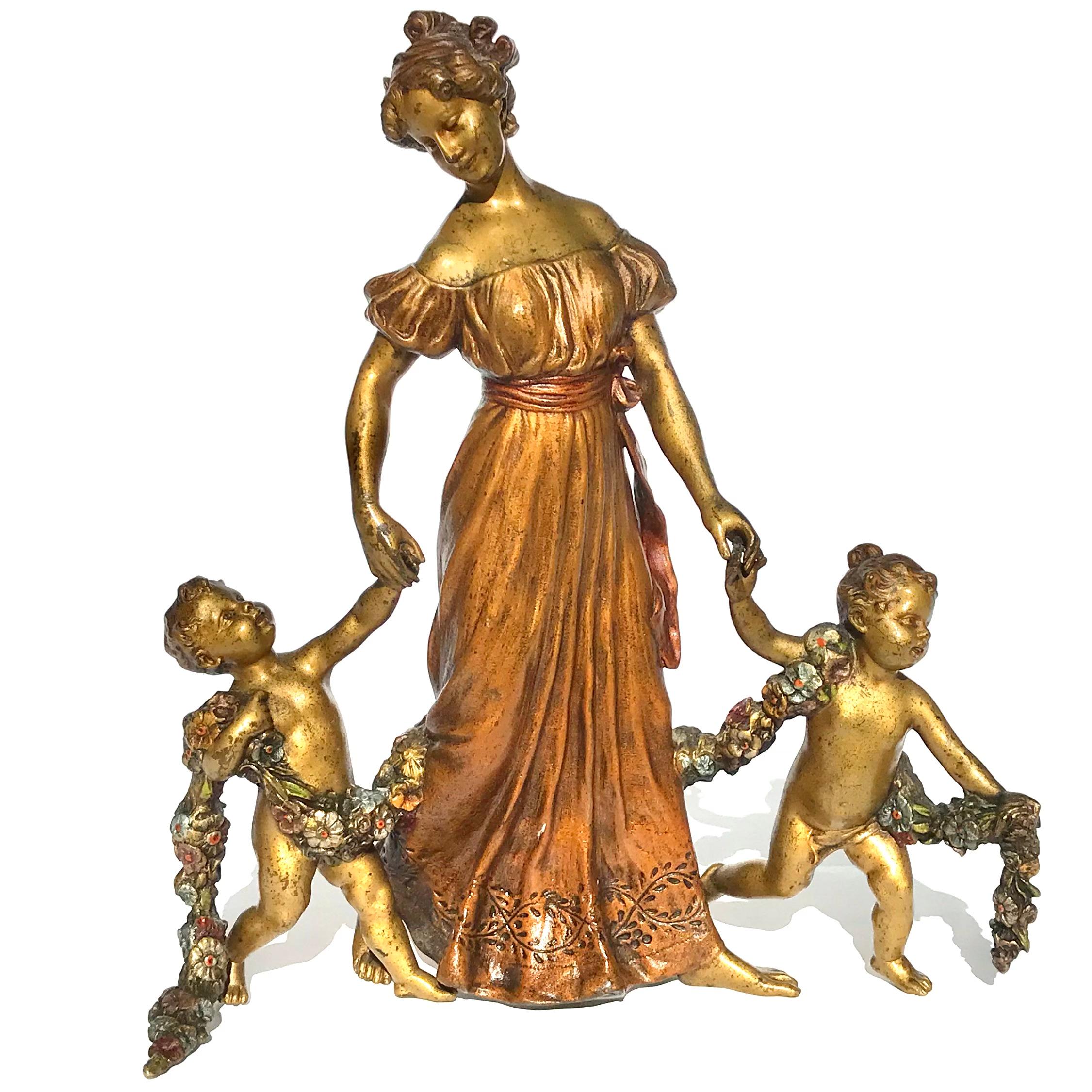 Franz Bergman Partial Gilt and Cold-Painted Bronze Figural Groups comprising of a Mother and her children. The nude boy and girl are draped in a cold painted garland all bare foot. An extraordinary figural grouping by Bergman and very rare.

circa