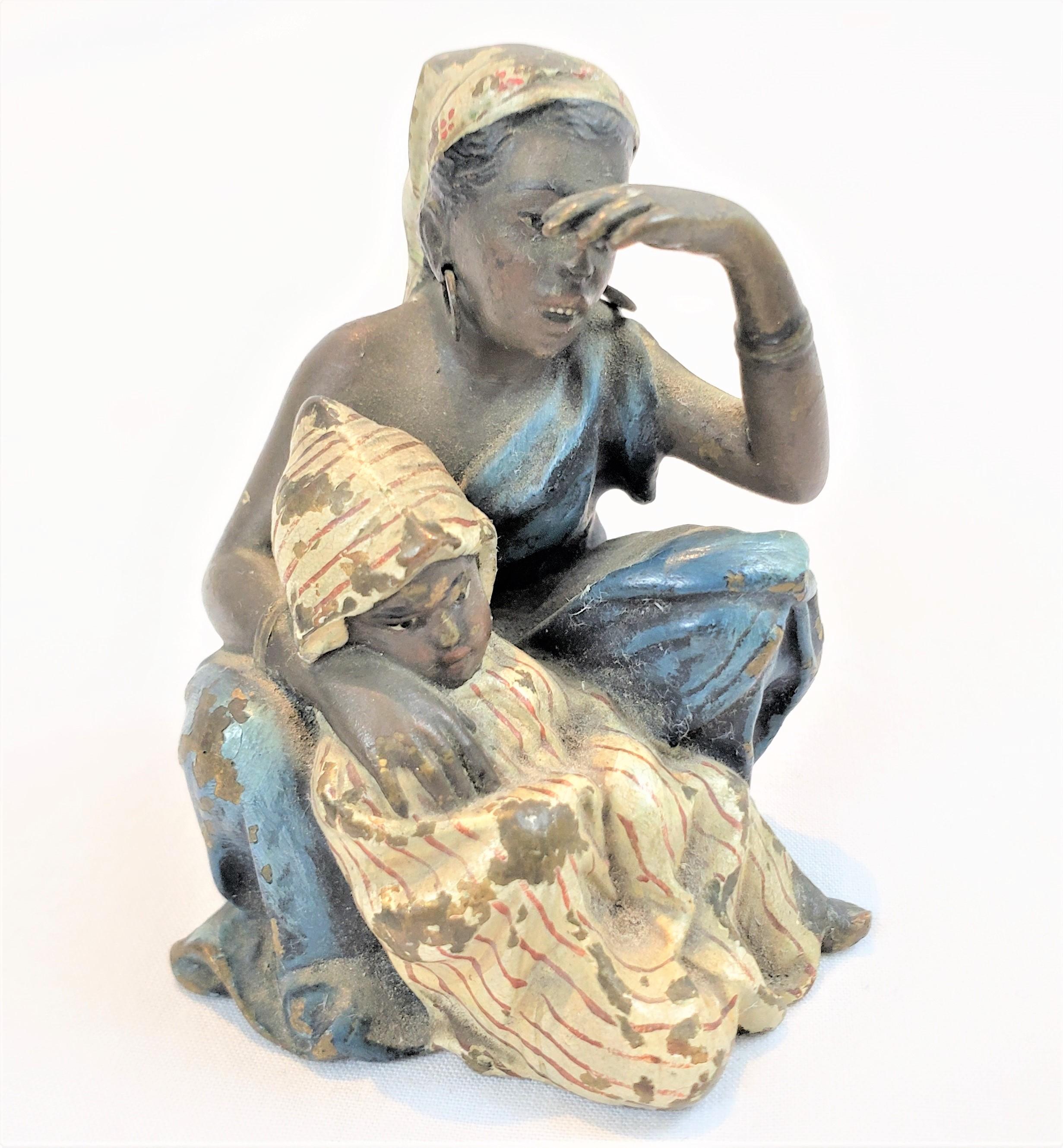 Thisminiature sculpture was done by the renowned Franz Bergman of Austria in approximately 1900 in his signature Bessarabian style. The study is composed of cast bronze with a cold-painted finish depicting a young Arab woman with her child. The