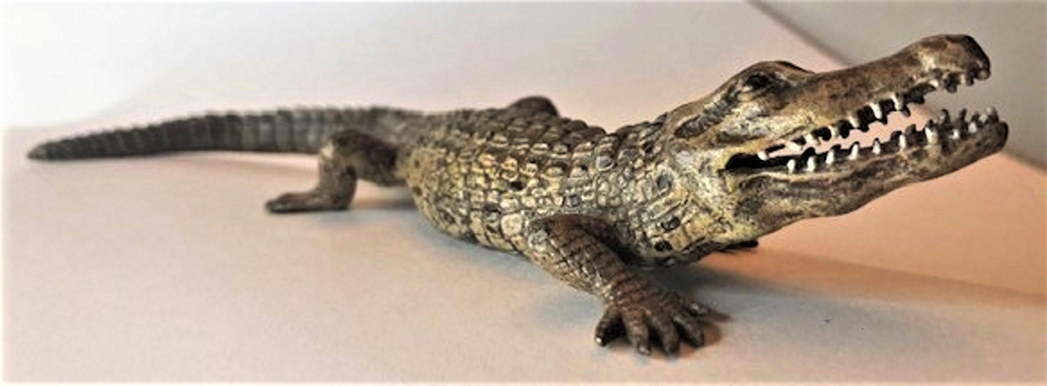Artist: Franz Xaver Bergmann

Sculpture: Crocodile

This wonderful life-like little sculpture of a crocodile is actually a most convenient paperweight, and a perfect desk accessory. Created in polychrome cold-painted bronze, and rendered in the