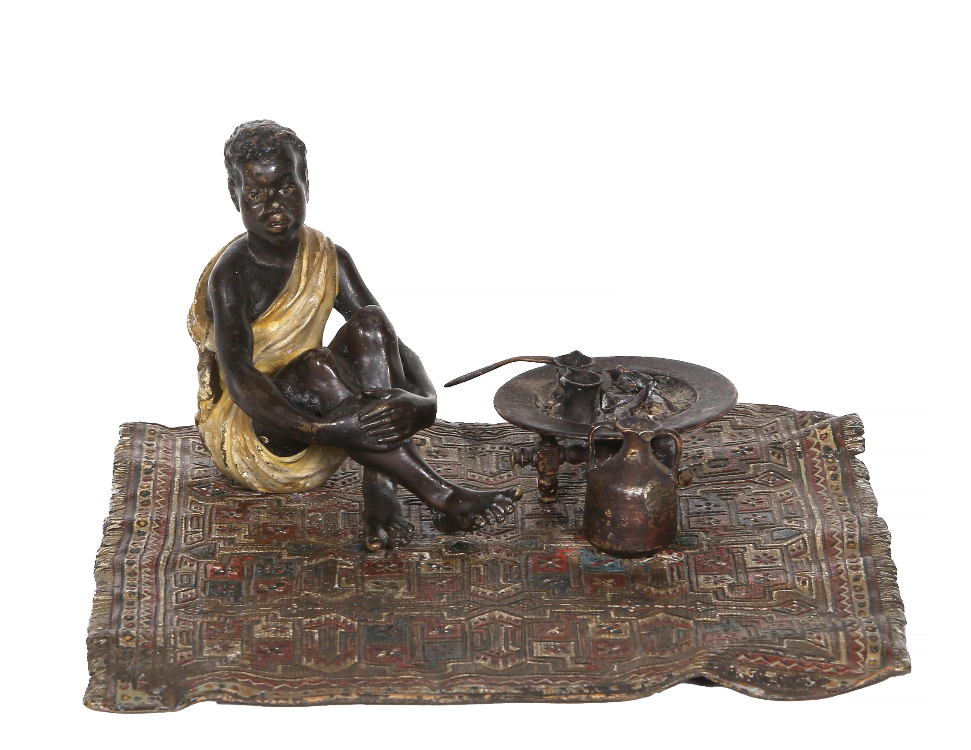 Franz Bergmann, Austrian (1861 -1936) - Boy on Persian Rug, Year:  circa 1900, Medium:  Cold painted Bronze sculpture, stamp signed on bottom, Size:  4 x 7 x 7.5 in. (10.16 x 17.78 x 19.05 cm)