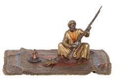 Man on Persian Rug, Orientalist Bronze Sculpture by Franz Bergmann