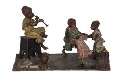 Piper et danseurs, sculpture orientaliste en bronze de Franz Bergmann
