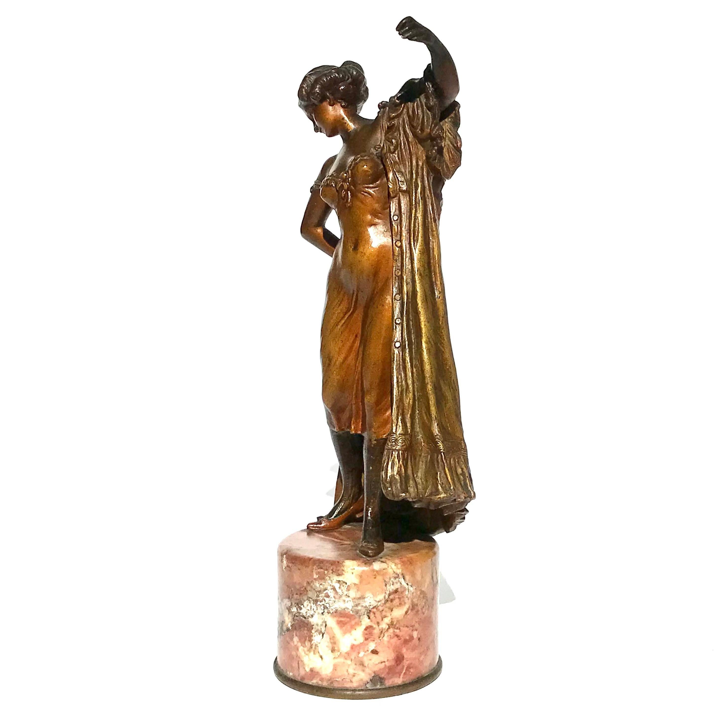 Franz Bergman Erotic Patinated Bronze Of A Woman Putting On Her Robe. Wearing a shear (almost) see through lingerie under garment; the lady is going through the motions to put on her dress. Tall and rare.
Height: 9.75 Inches with marble.
circa
