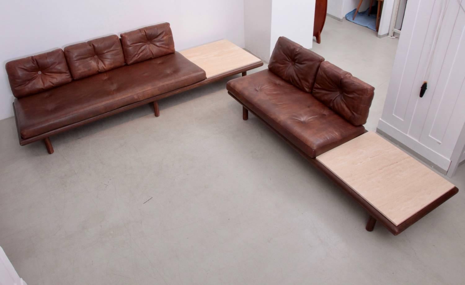 Original leather and travertine sofa set #6603 by High-End Manufacturer Kill International. All legs are also leather covered.
Fully functional vintage condition. The settee including travertine side table is: 223cm long / 88