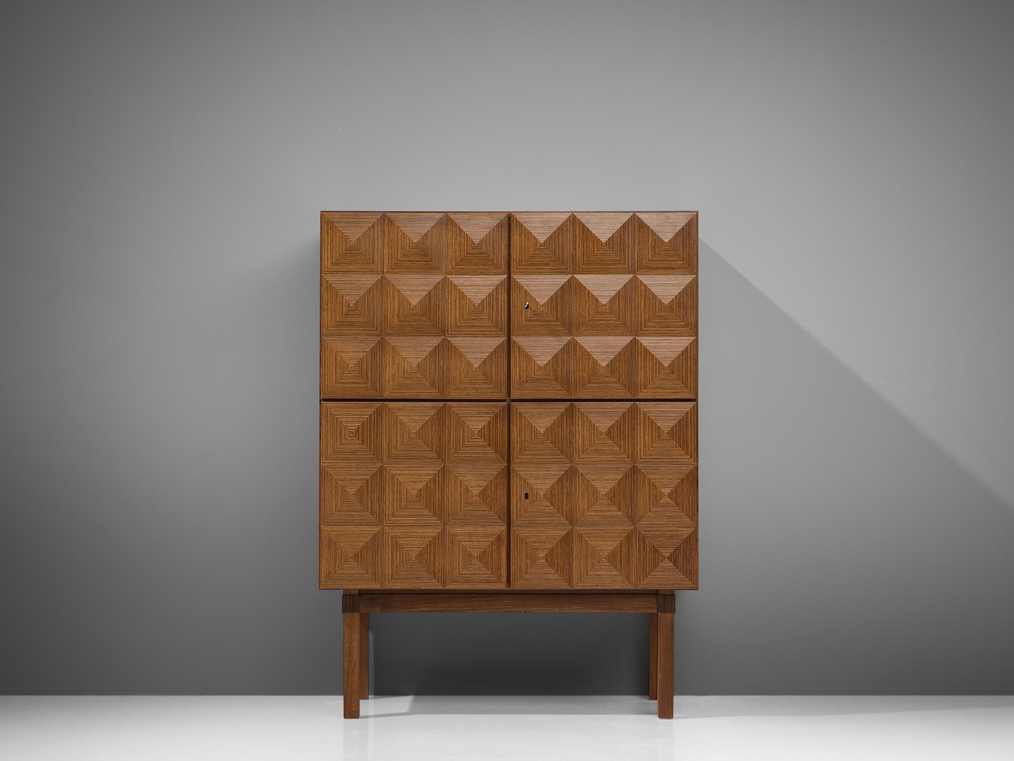 Franz Meyer, highboard, rosewood, Germany, 1960s

Subtle ‘brutal looking’ high board by master furniture maker Franz Meyer from the 1960s. The four doors of this cabinet feature a diamond-shaped structure, which highlights the rosewood in an