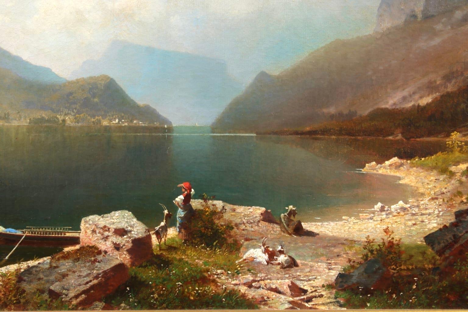 A beautiful oil on original canvas by Austrian Romantic painter Franz Richard Unterberger depicting  a figure on the lake's edge looking out across the lake, with a boat moored on the rocks and a view of the mountains in the distance. Lake Achen