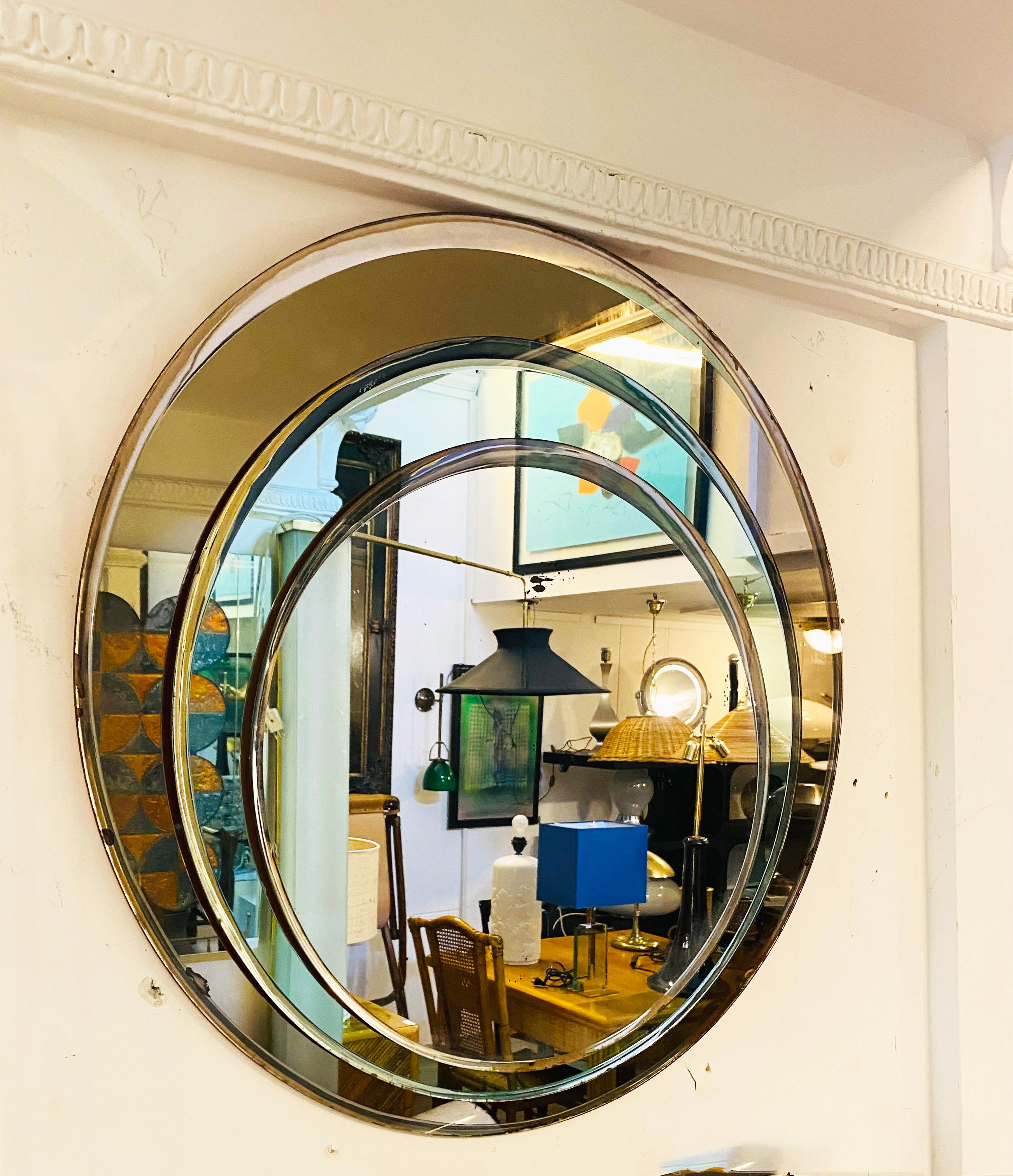 Elegant three-circle mirror by Cristal Art, Italy circa 1960, three different sizes mounted on wood, Design: Franz J. Sartori. All glass panes have a ground edge in very good condition.
No damage on the glass. Small signs of age on the mirror.